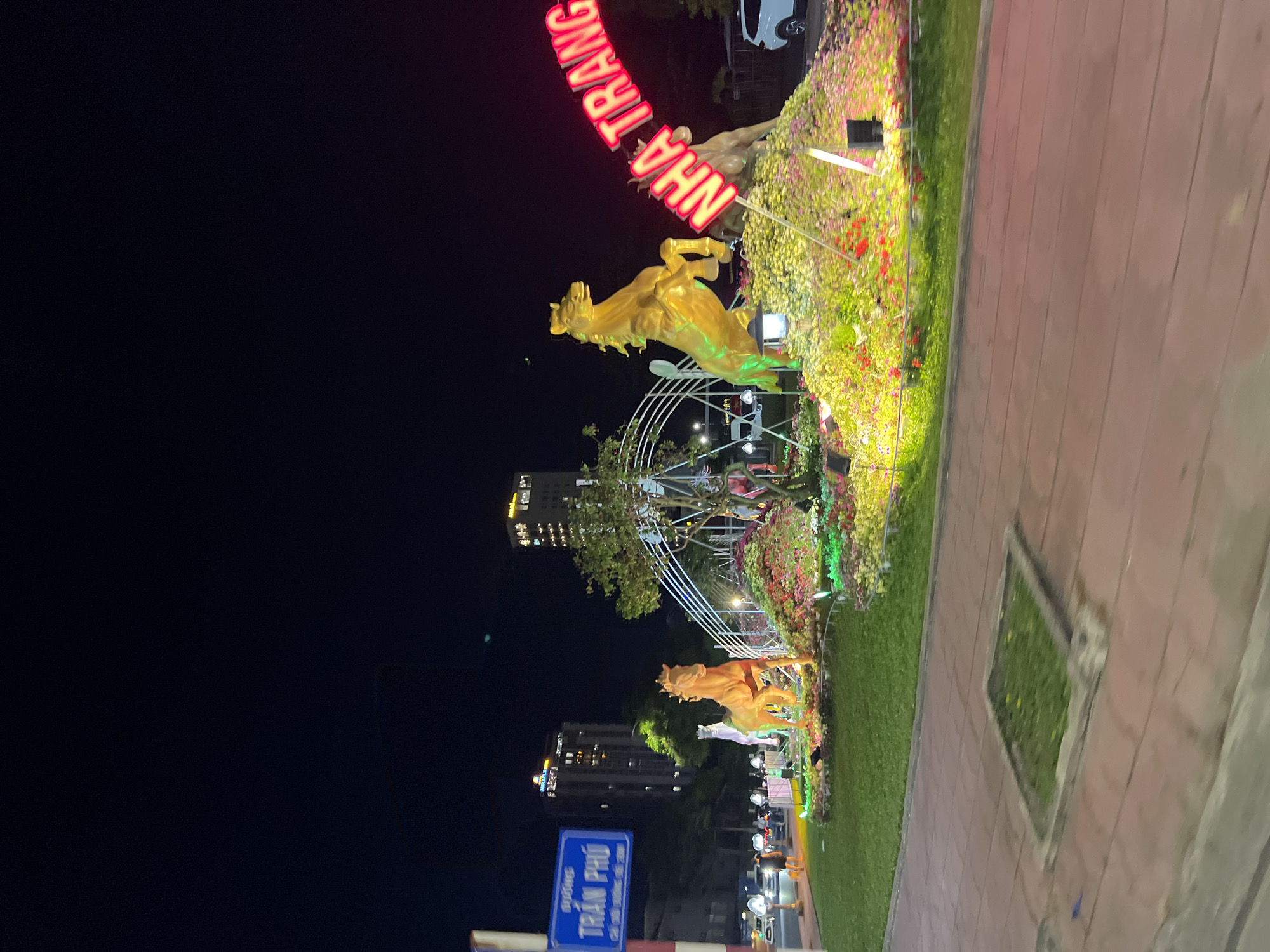 Golden horse street art installation illuminated in Nha Trang