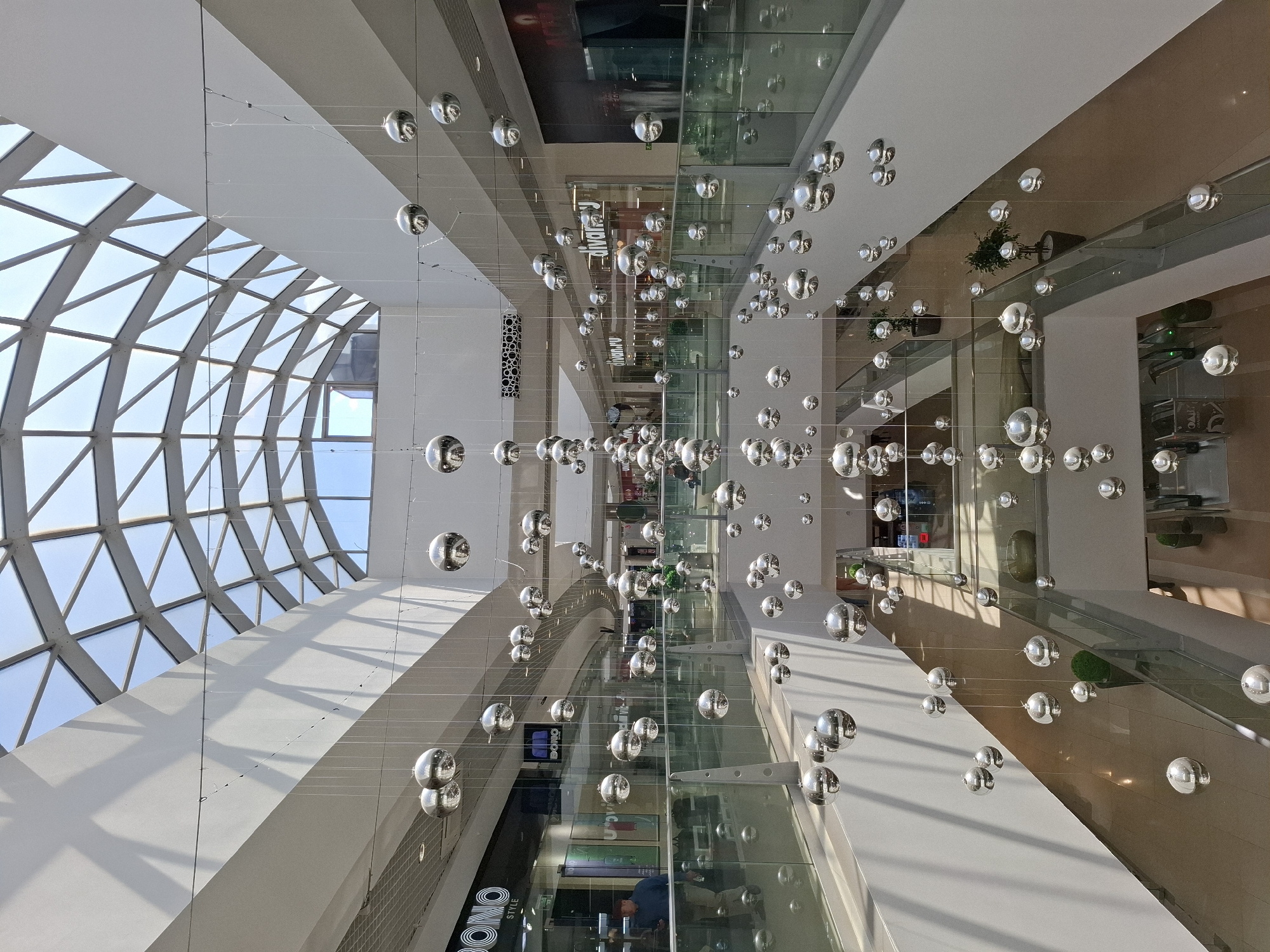 Early morning view captures multi-level mall's arched glass ceiling