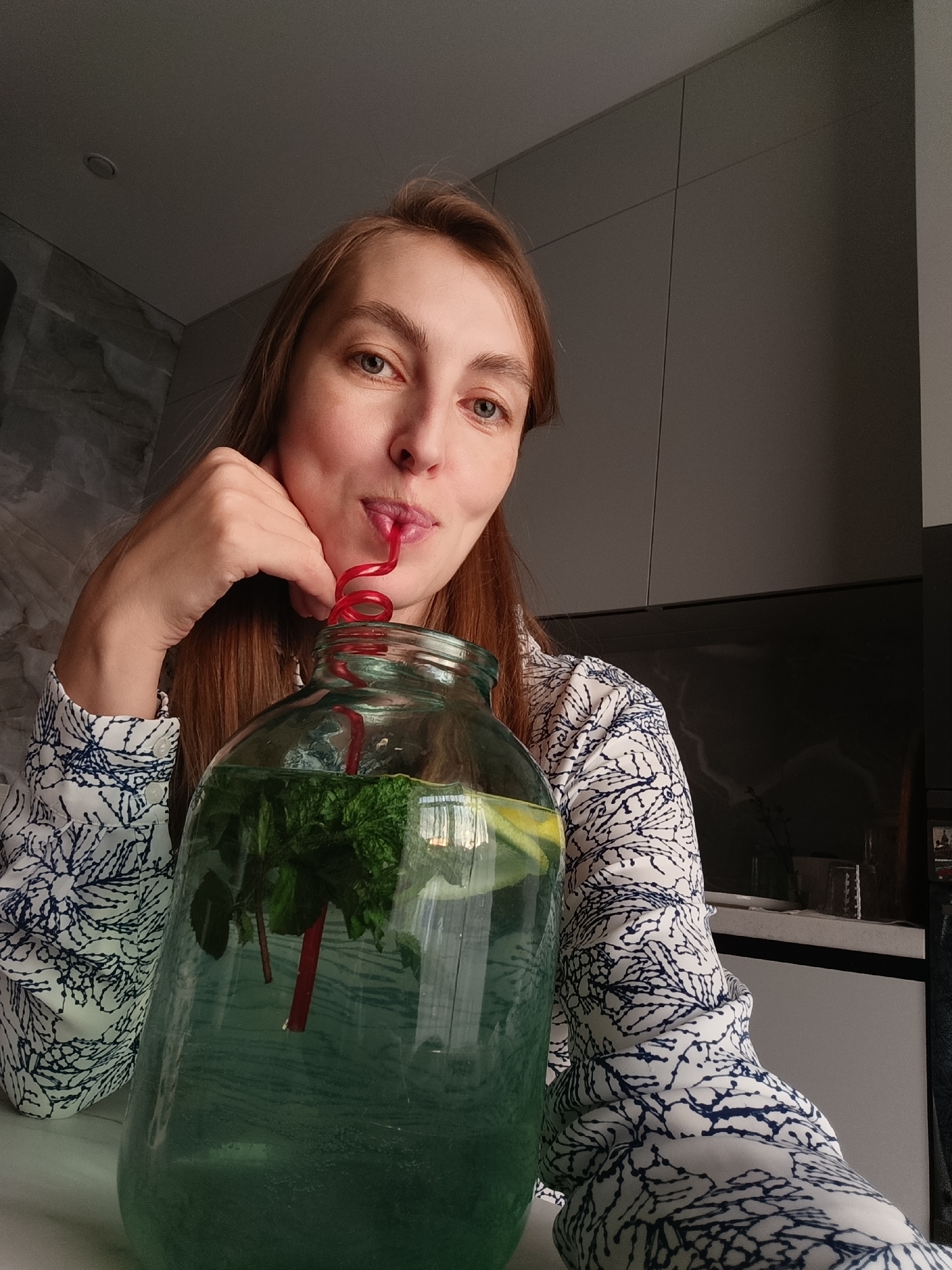 Woman documents quiet evening at home with cat in Chaikovsky