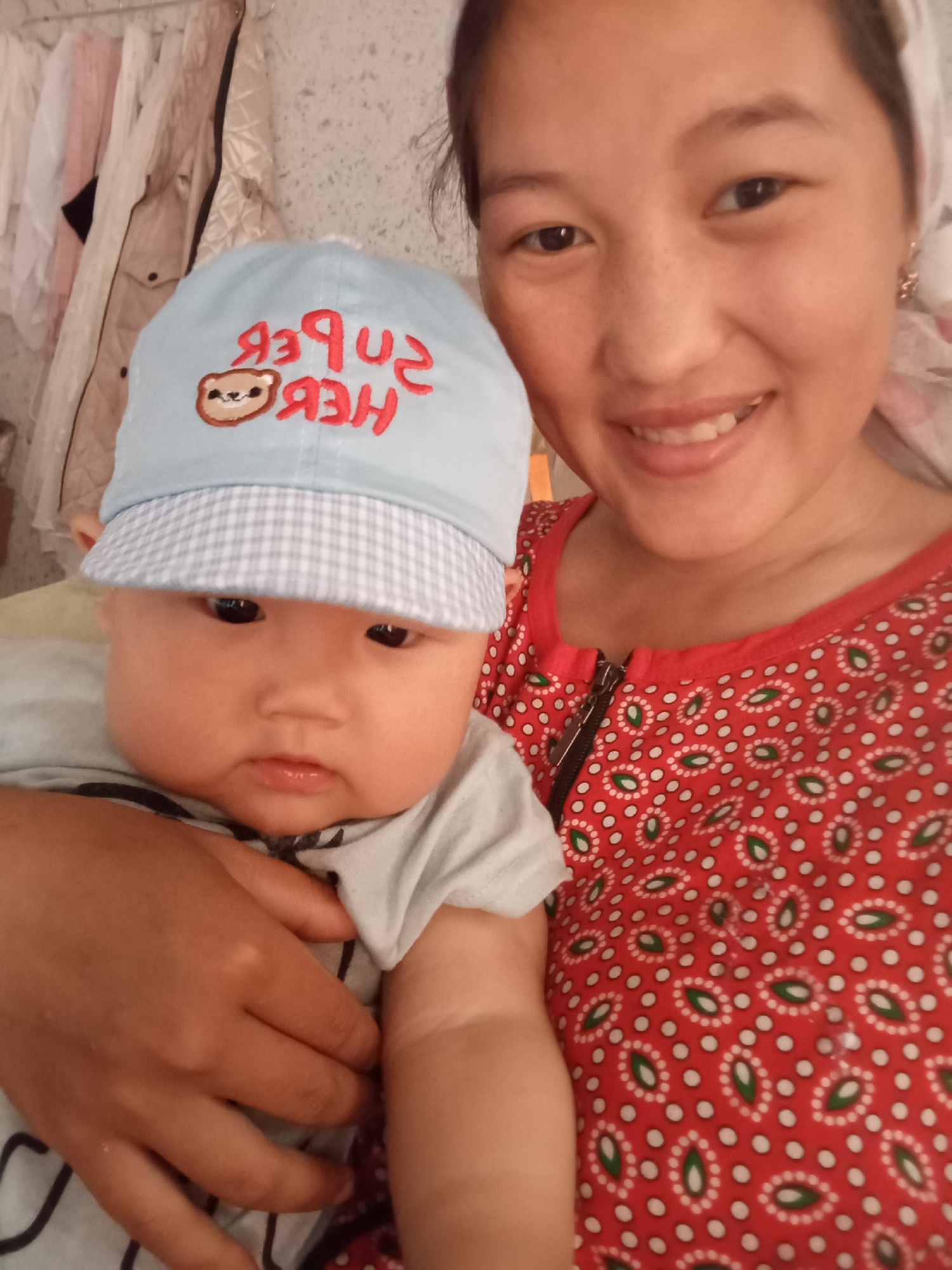 Baby photos, home scenes, and medals in Boston, Kyrgyzstan