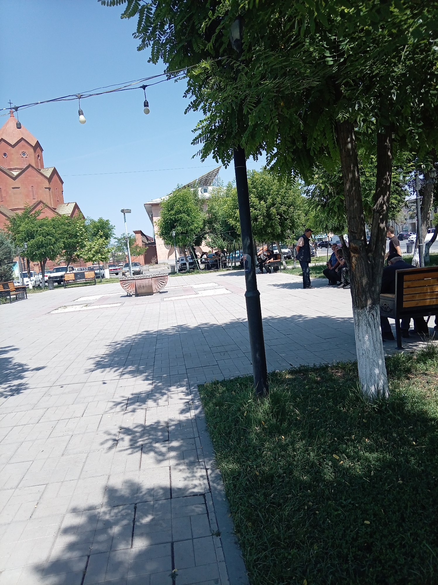 Urban scenes captured: church square and parked street