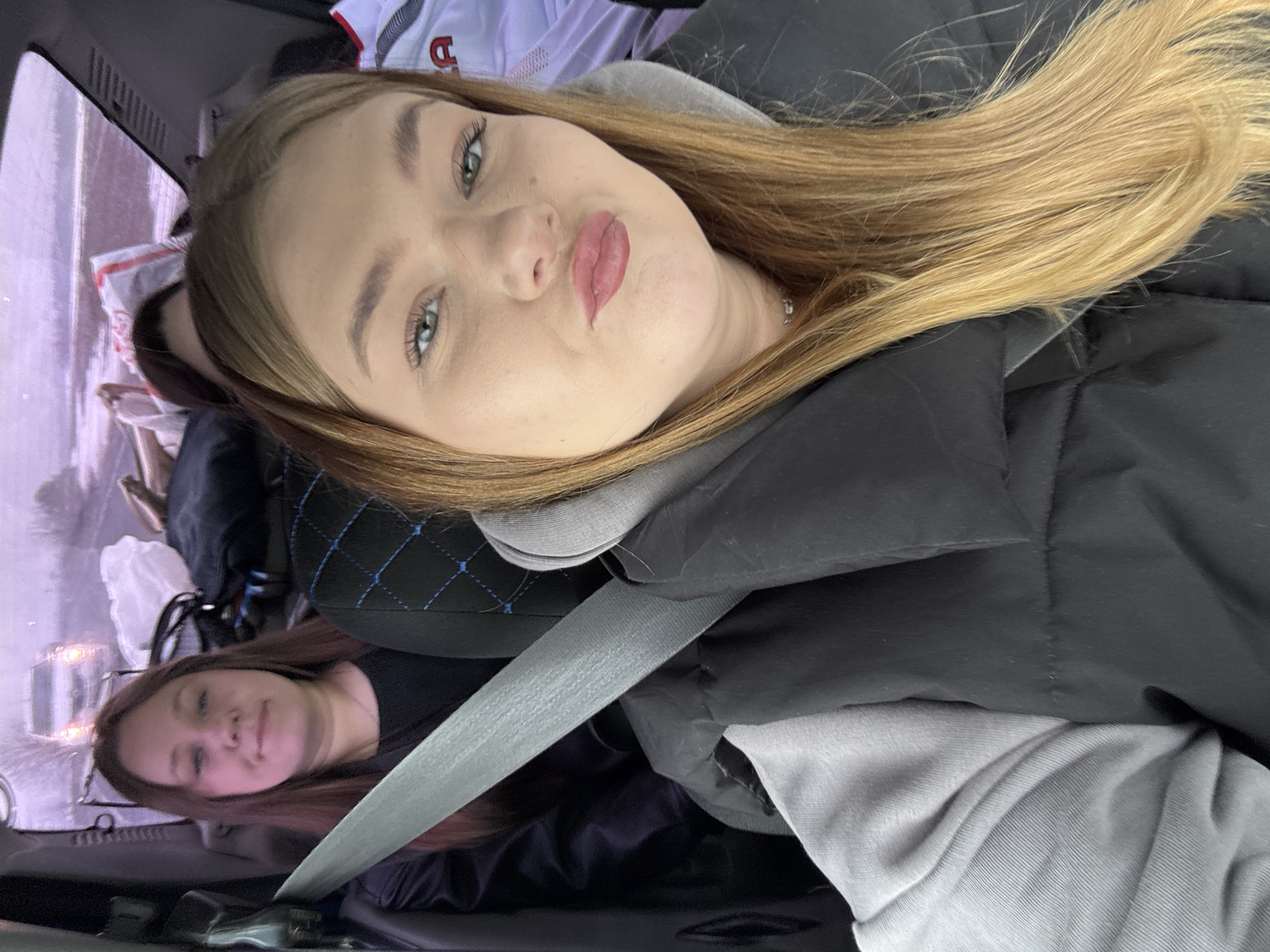 Two women observed in vehicle backseat in Perevoznoe, Russia