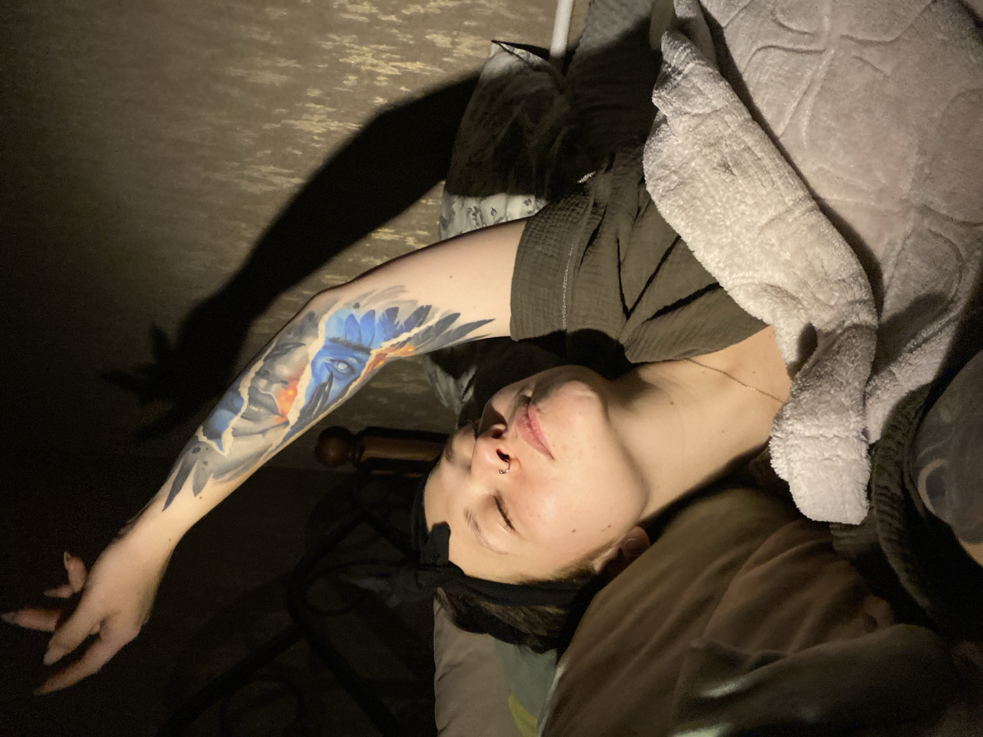 Person reads Russian book in bed in Chaikovsky