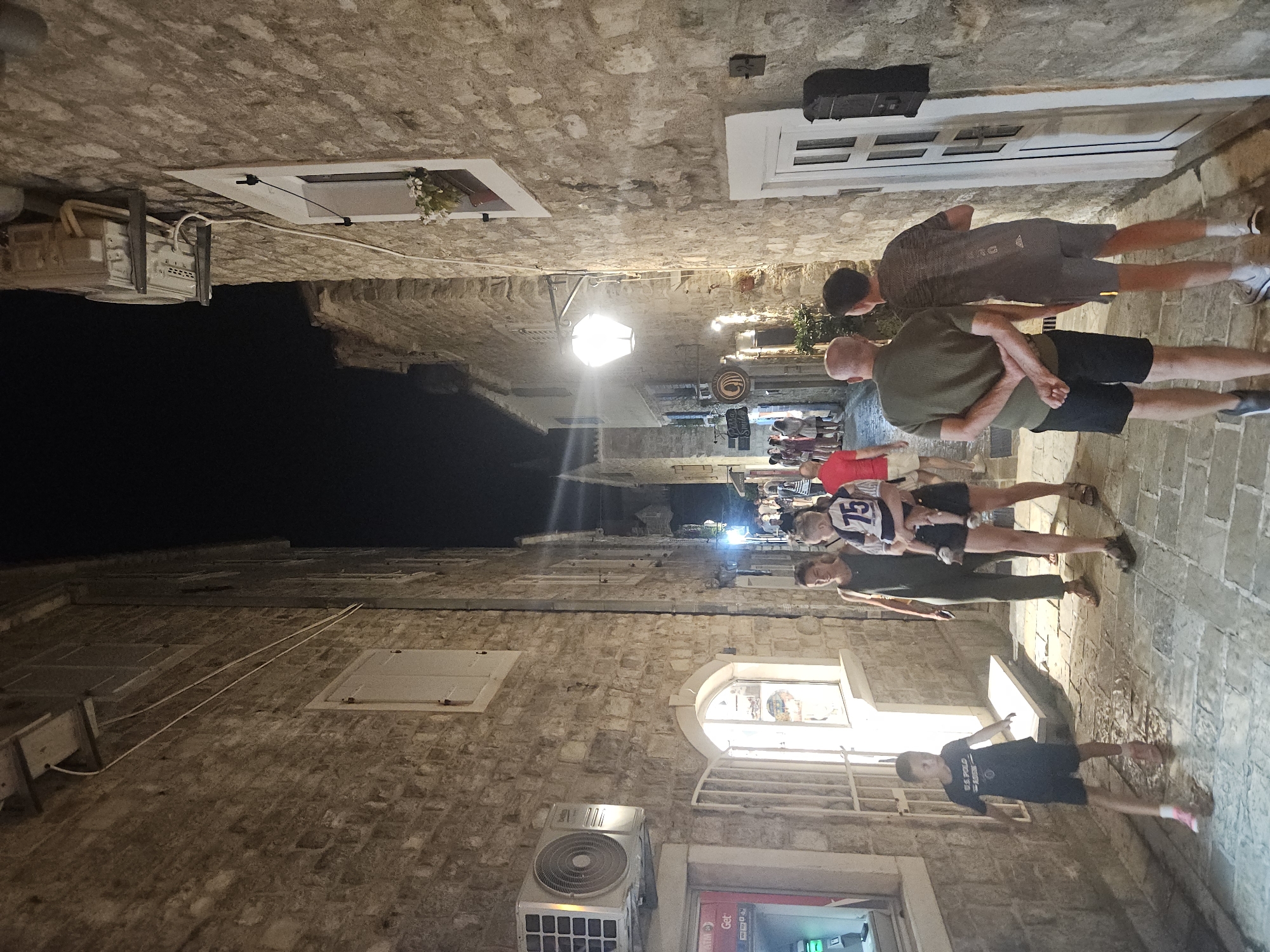 Mediterranean marina night: yachts, old town alleys, harborside pub