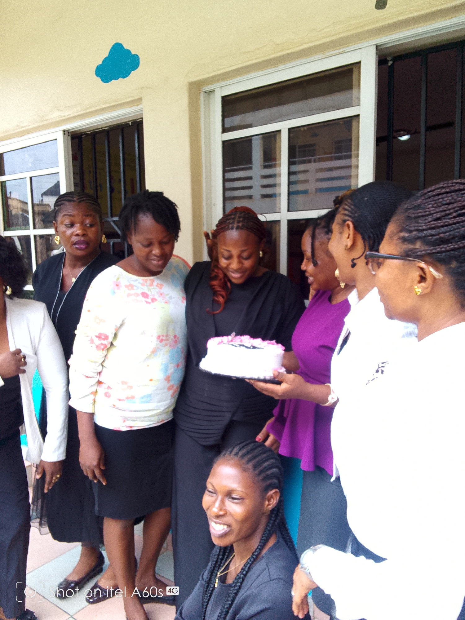 Women celebrate birthday with cake at Nigerian school