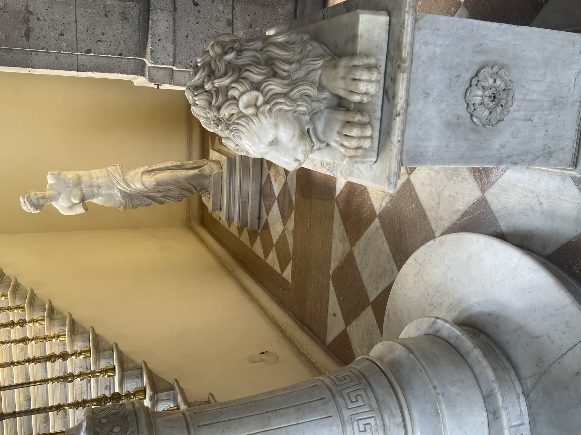 Visitor documents ornate interior features at Mexico City cultural site