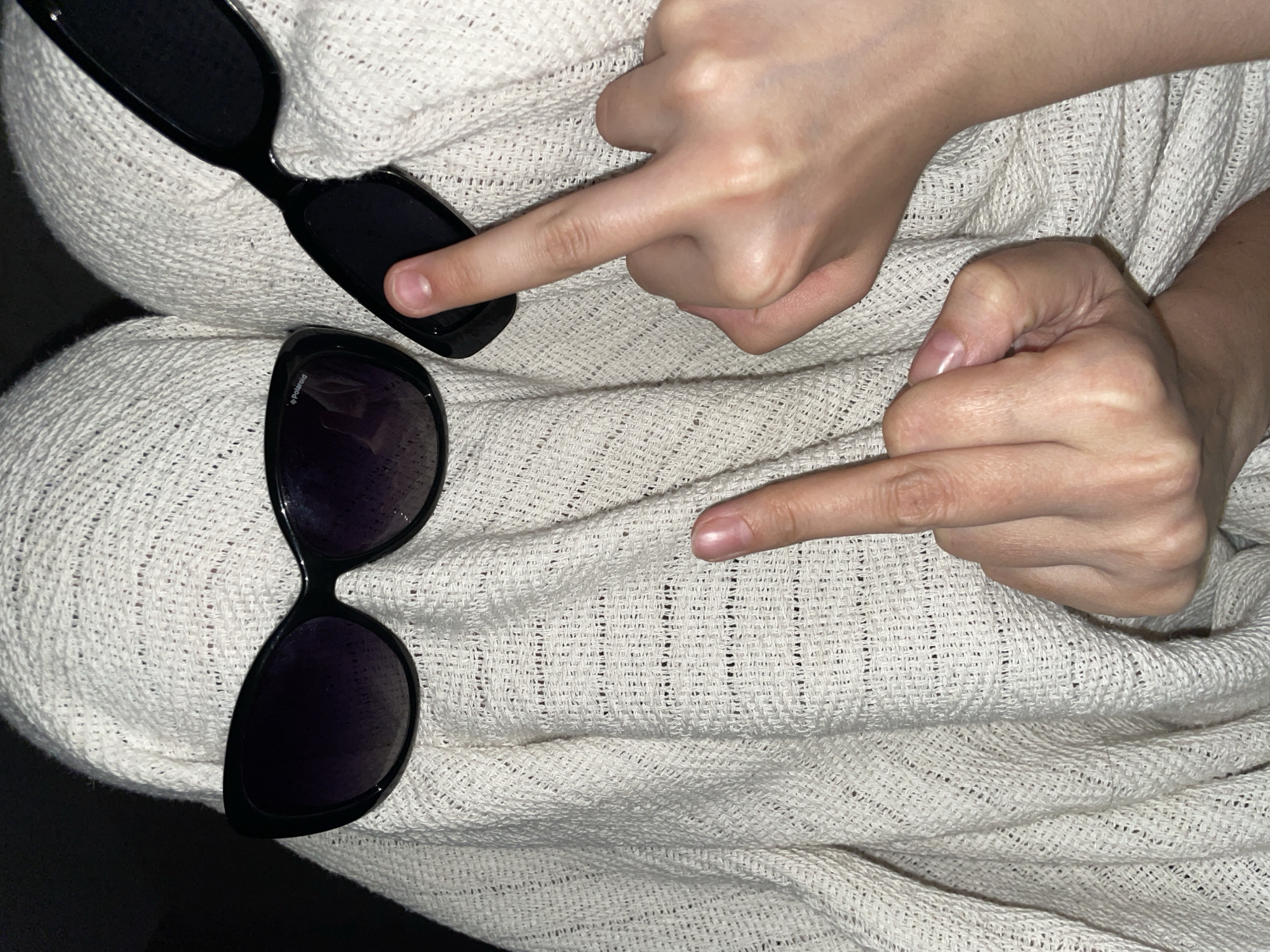 Two women share quiet evening moments in Izhevsk bedroom