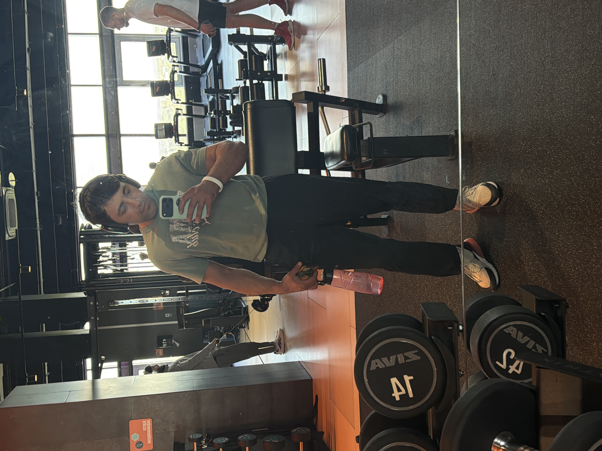 Man takes mirror selfie at Krasnoyarsk fitness center