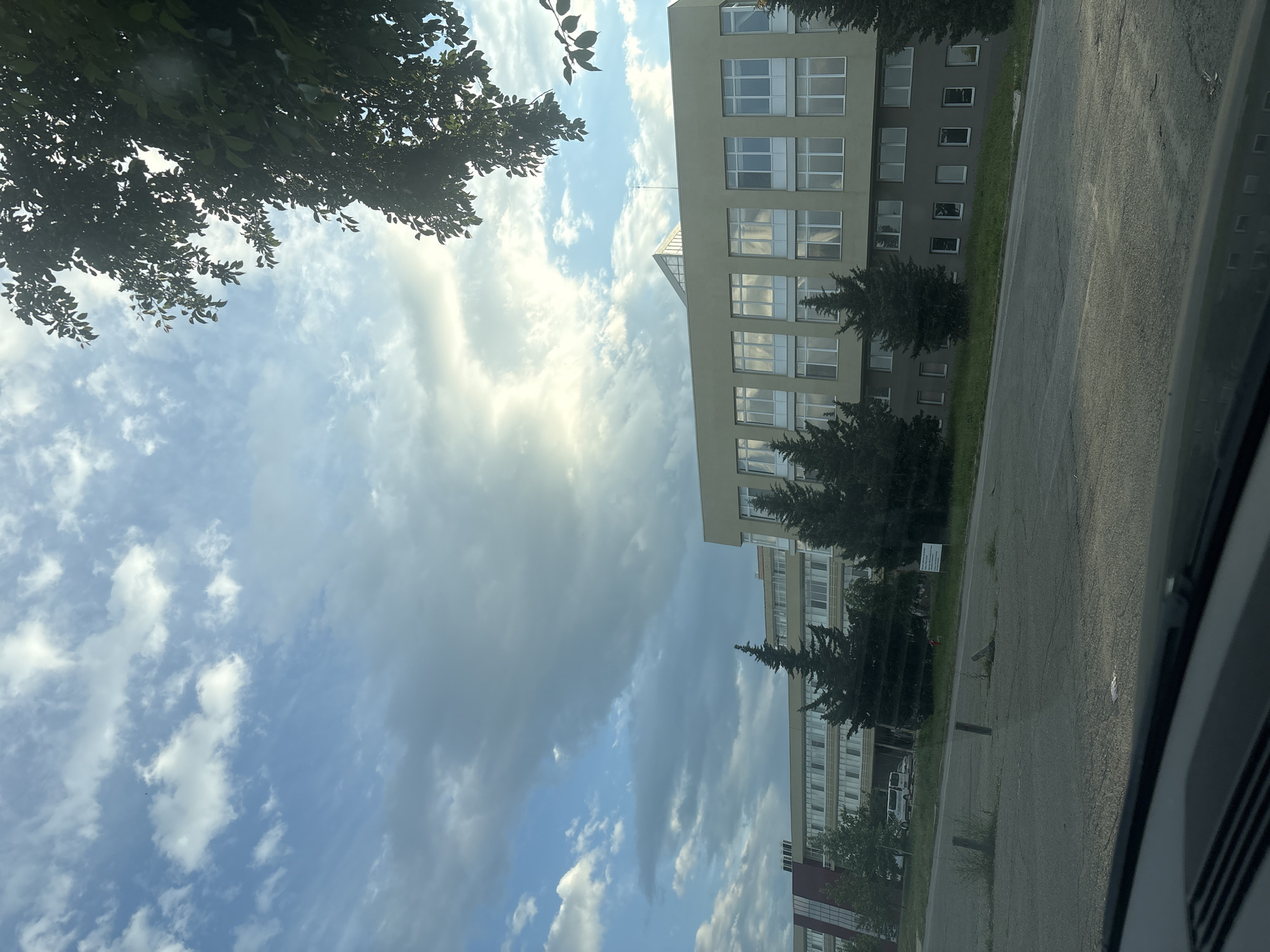 Multi-story building photographed under blue skies in Stara Zagora