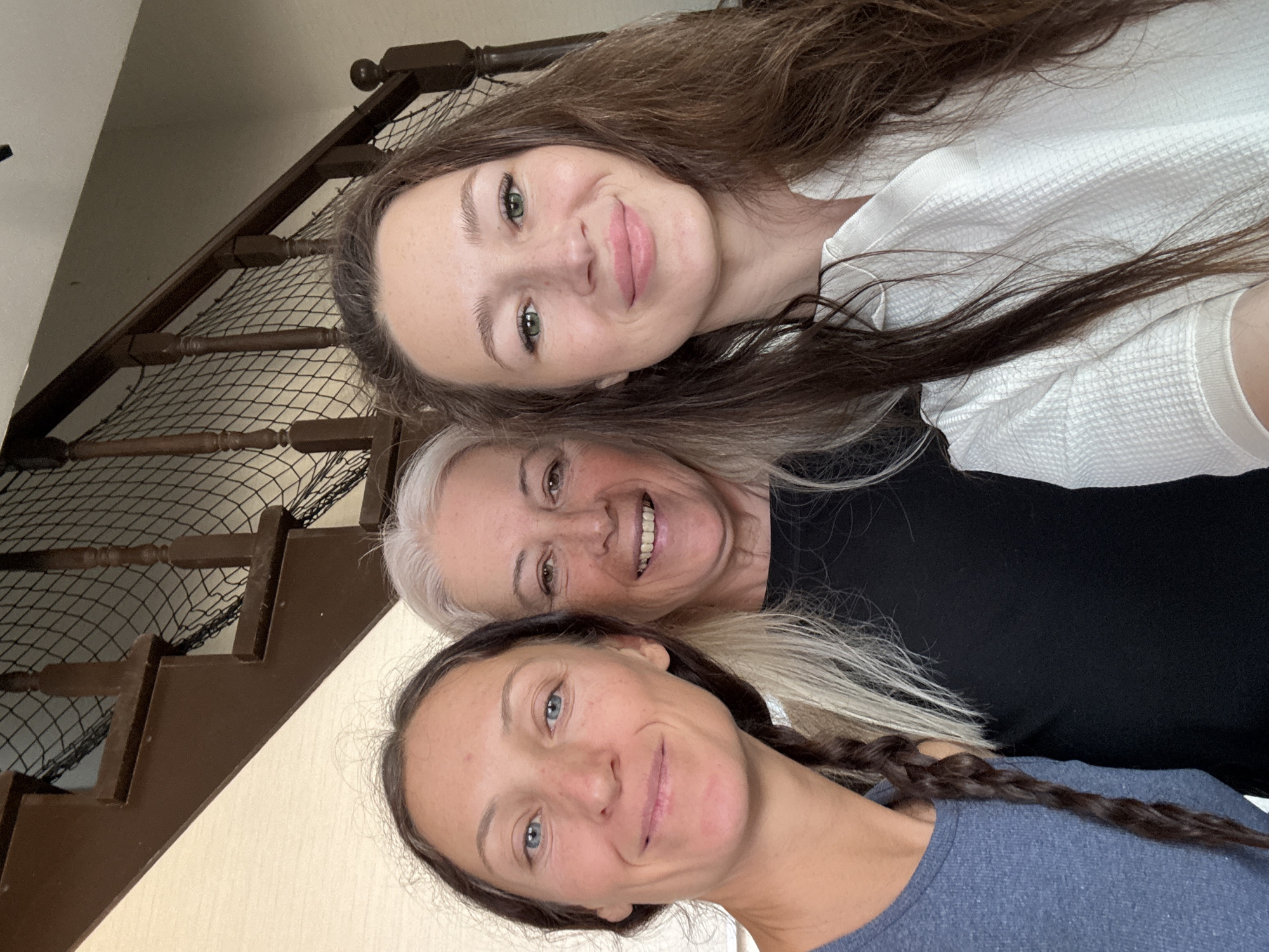 Three women pose for smiling portrait in Ulyanovsk