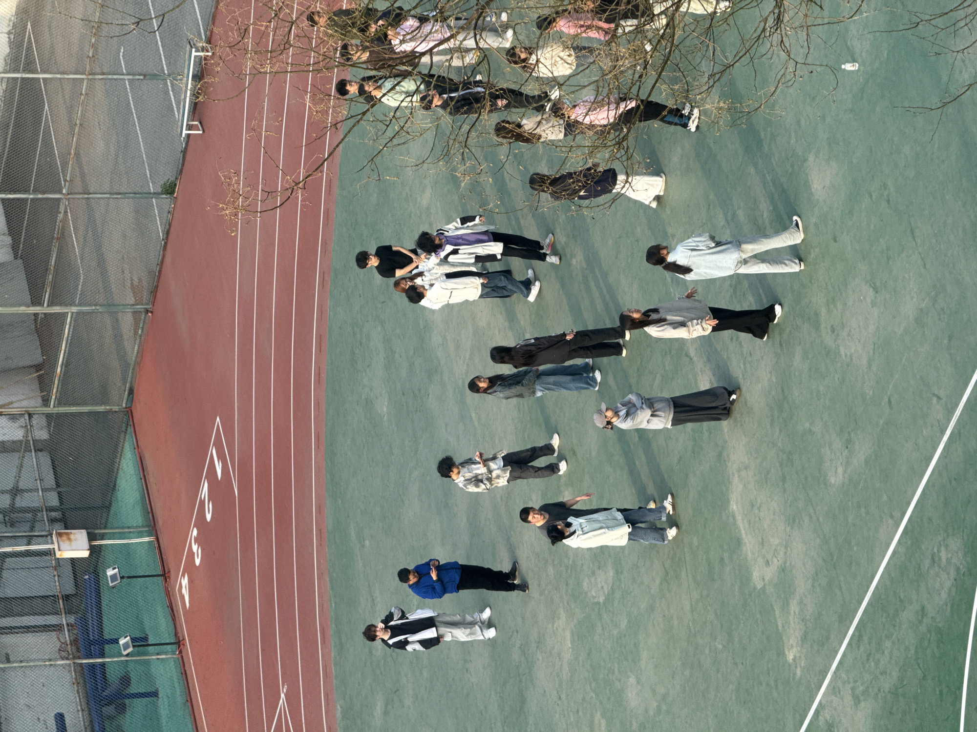 Group of 20 lies on athletic field in Beijing's Daxing District