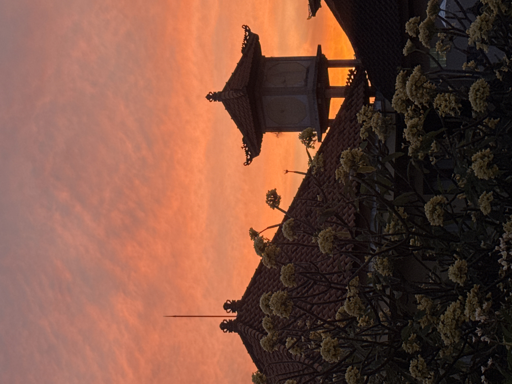 Balinese temple silhouette at a colorful Kuta sunset