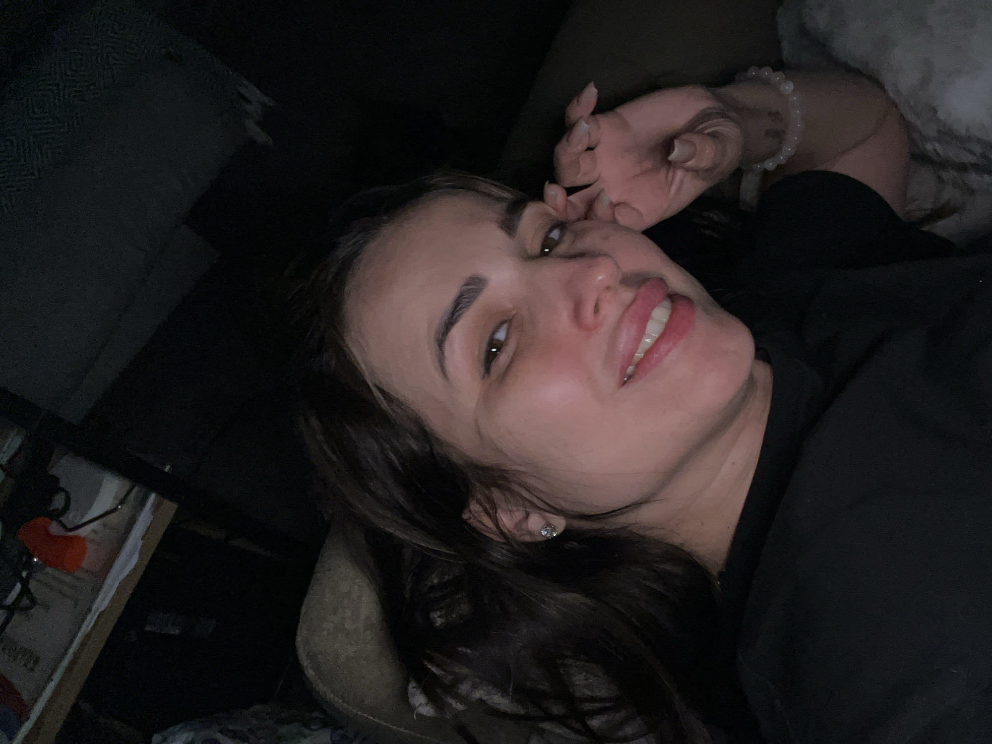 Woman captured in playful bedroom moments during afternoon