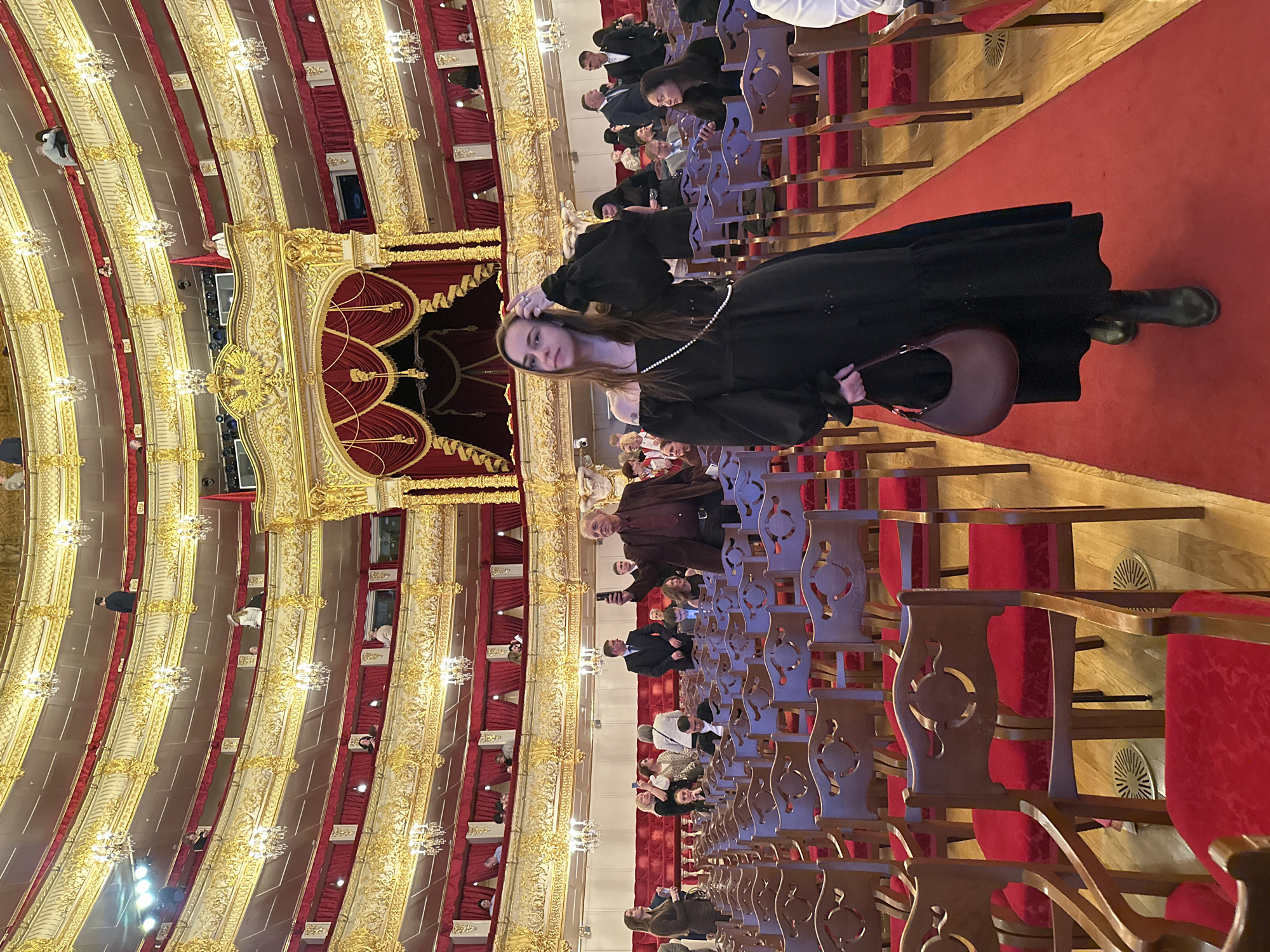 Moscow theater interior captured showing ornate red-gold balcony design