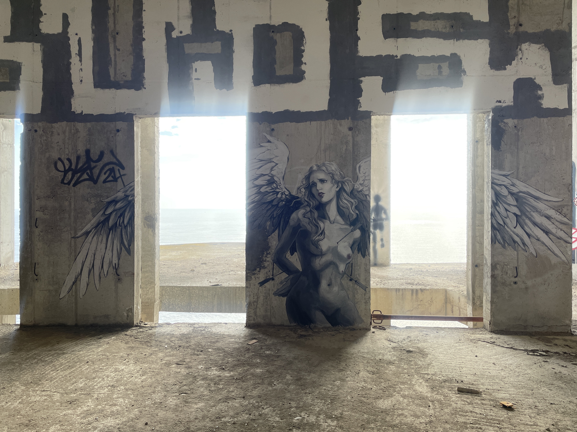 Street art documented in abandoned concrete structure, Montenegro