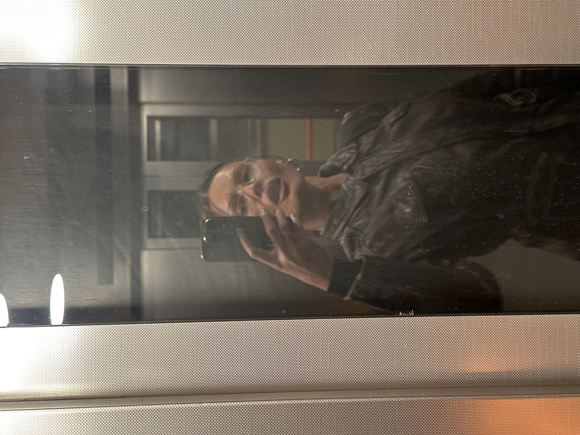 Woman takes elevator selfie in London