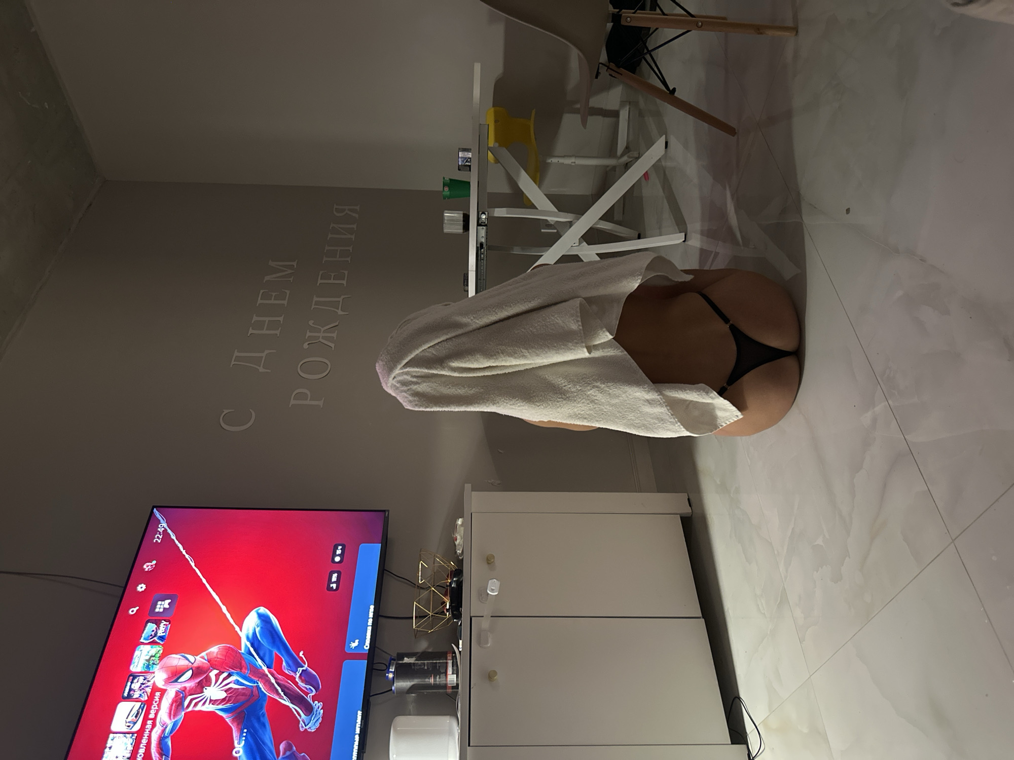 Indoor nighttime scene captured with person and television