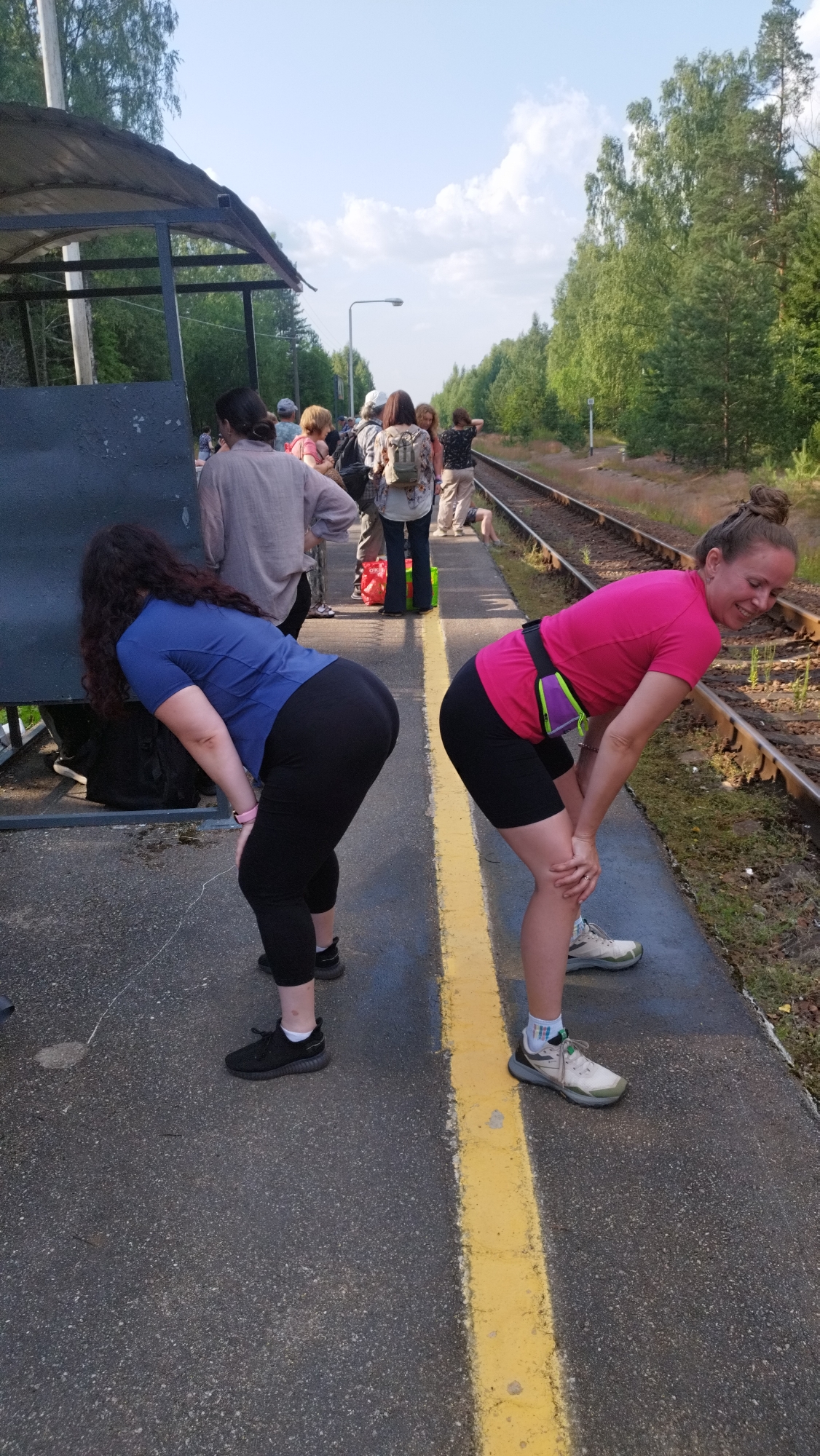 Backpacker group waits at Tarasovskoe station for a diesel train