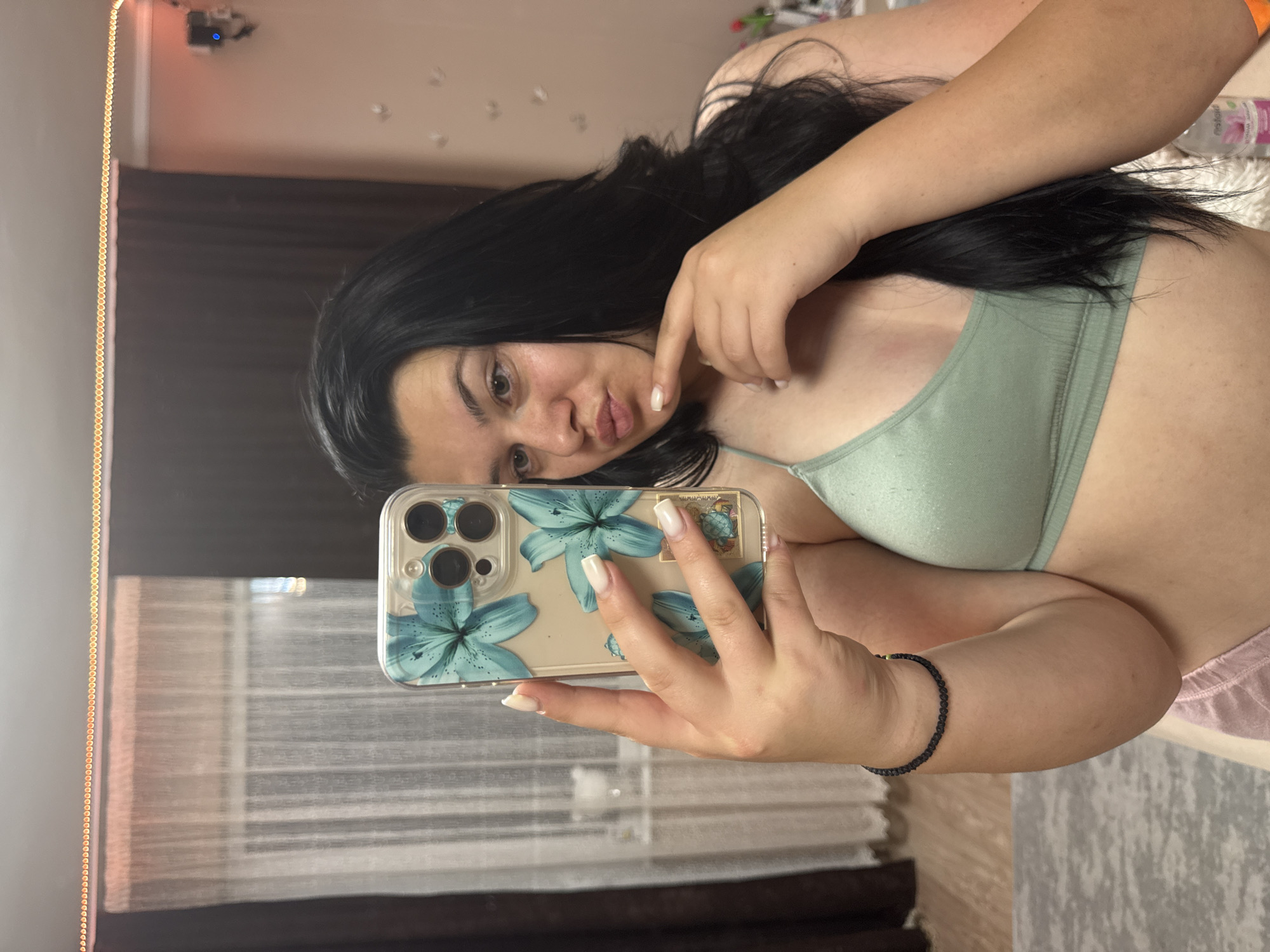 Woman takes selfies during evening skincare routine in Bulgaria