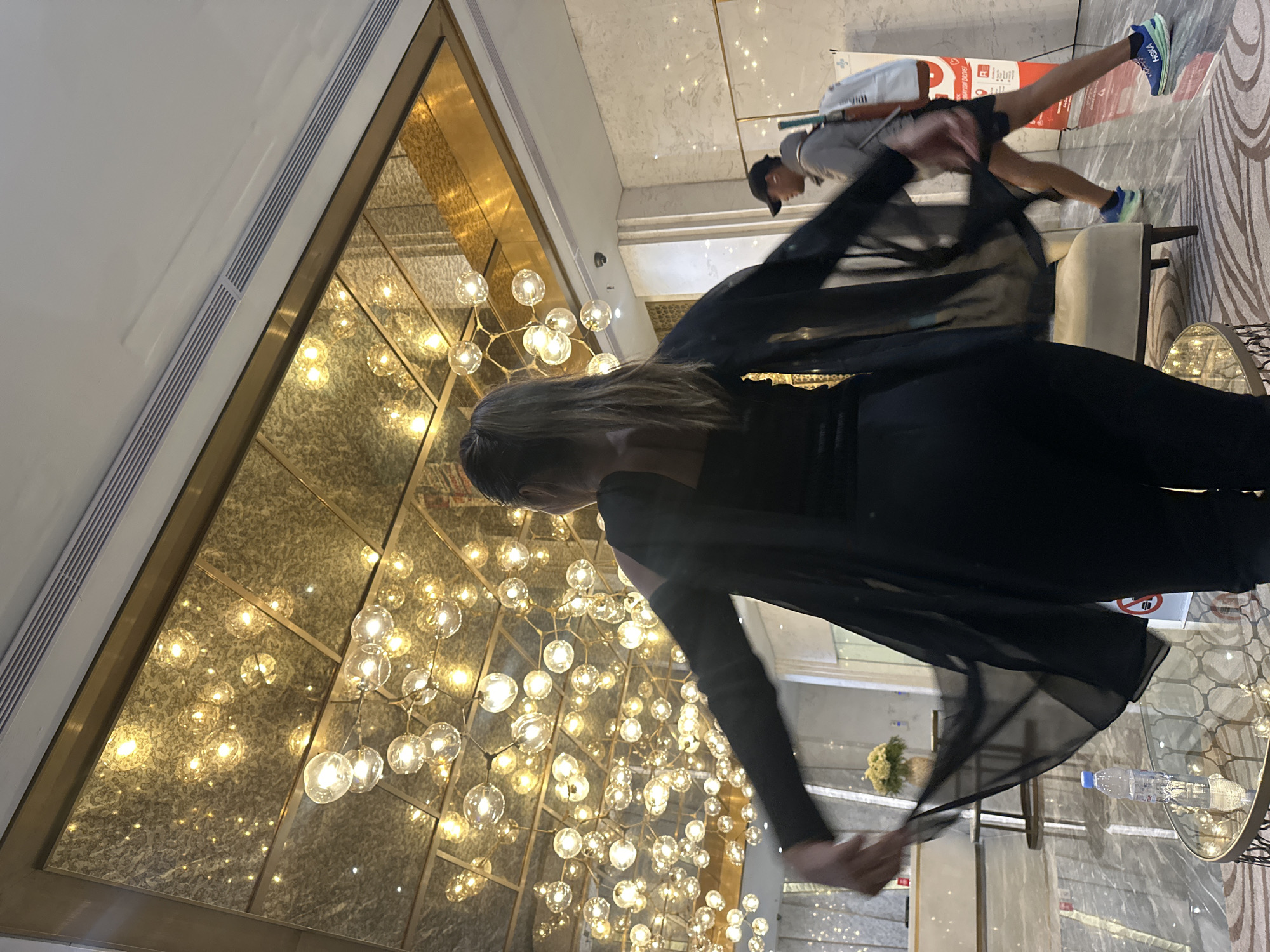 Woman poses for photo session in luxury Jakarta hotel lobby