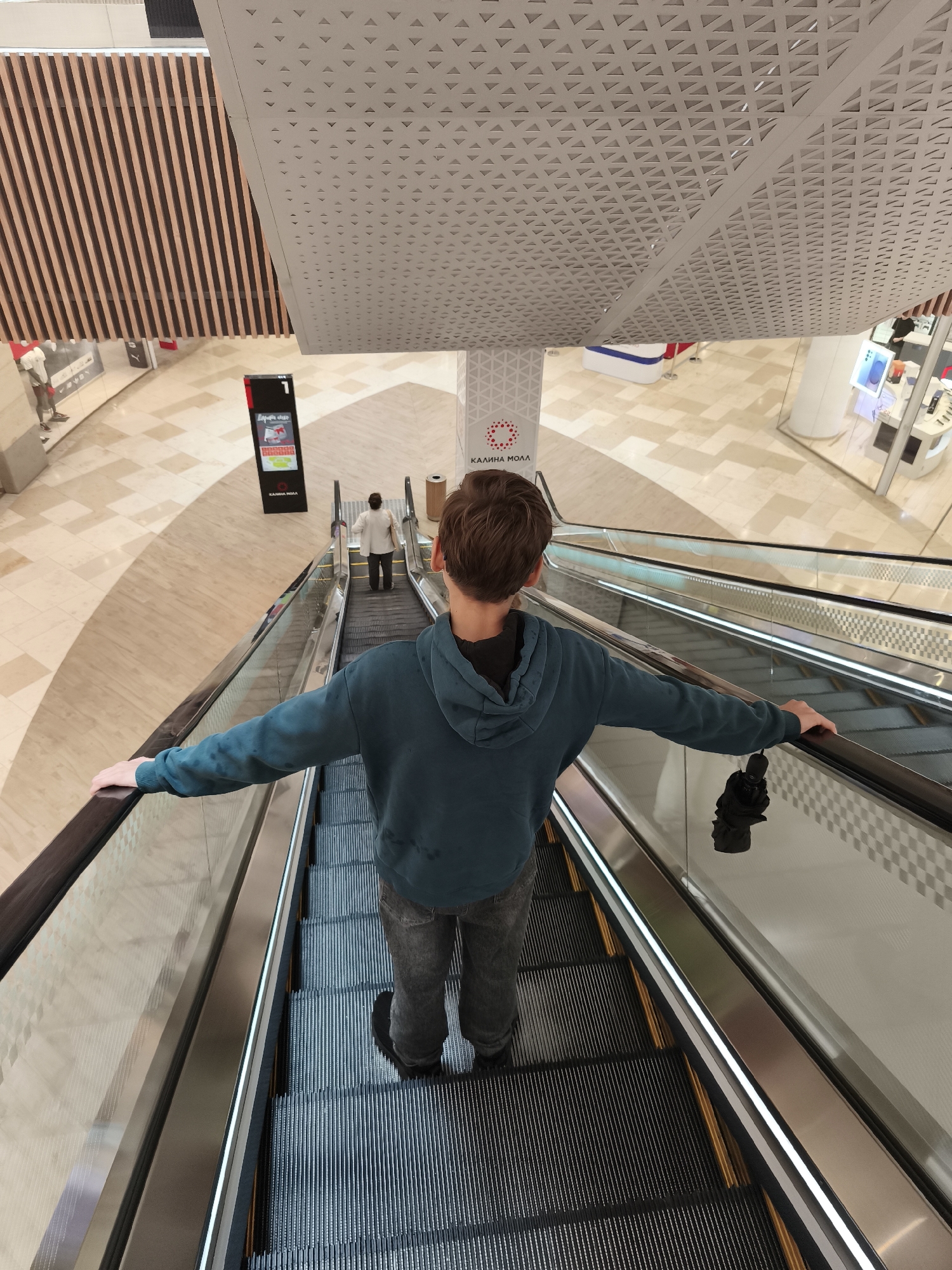 Inside a Vladivostok shopping mall with a flight simulator on display
