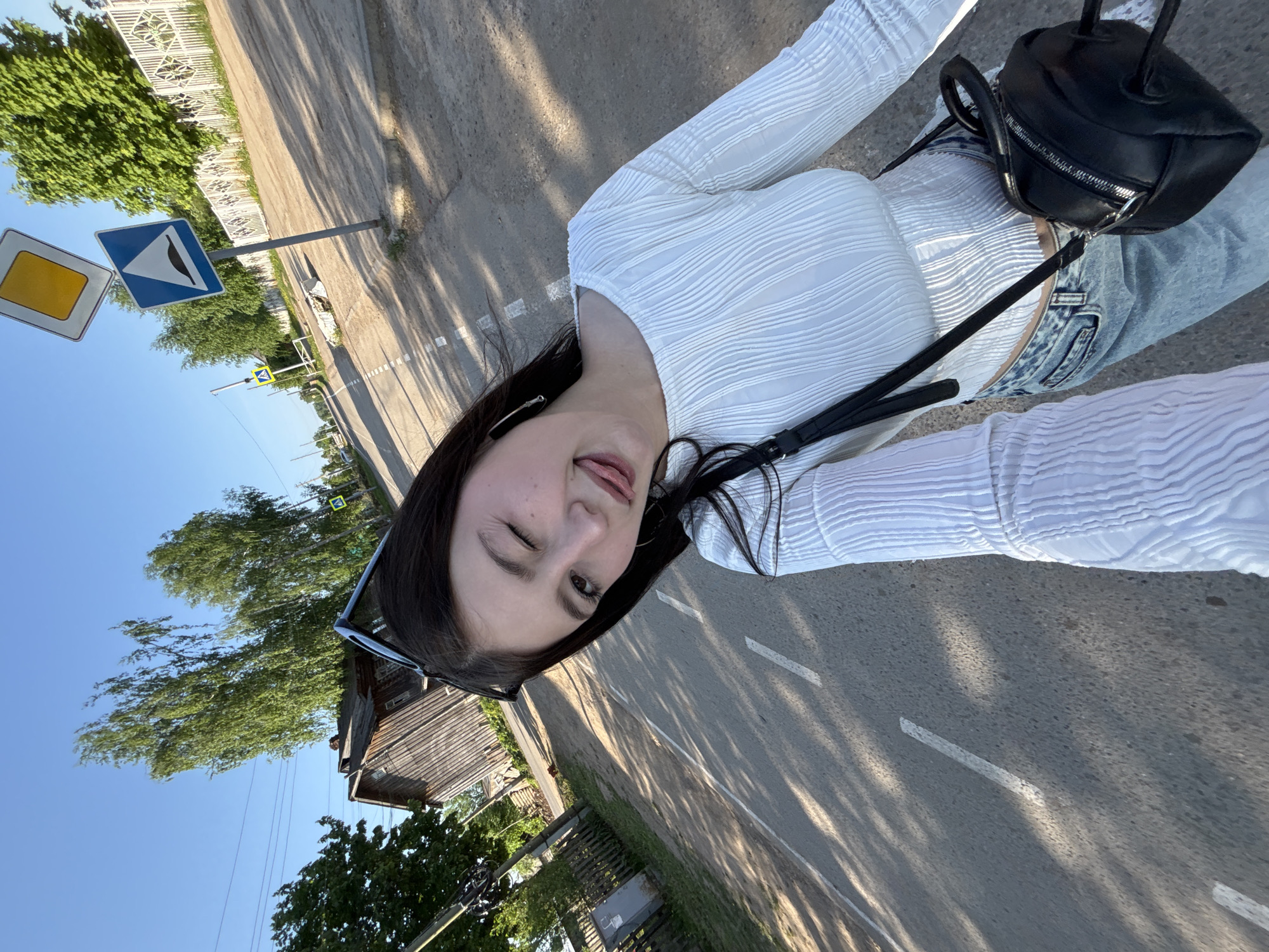Woman takes selfie on street in Фоки, Russia