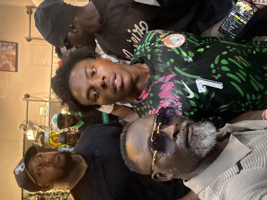 Soccer jersey-wearing figure draws crowds across Lagos districts