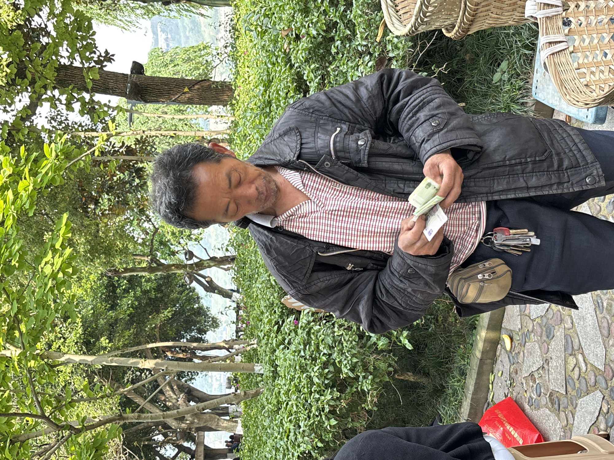 Elderly men gather along Yangtze River waterfront in Jiangjin