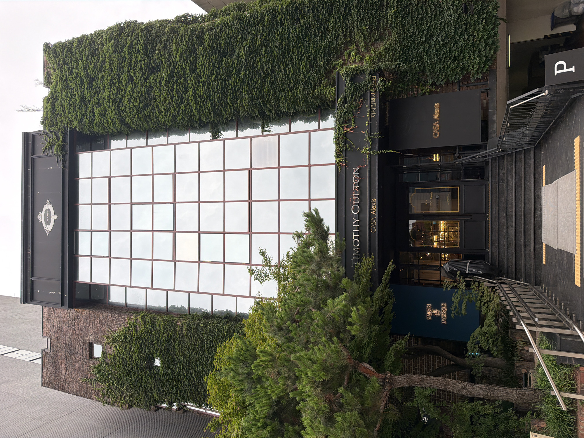 Seoul street-level mix: ivy, a Bentley, a church, and high-rises