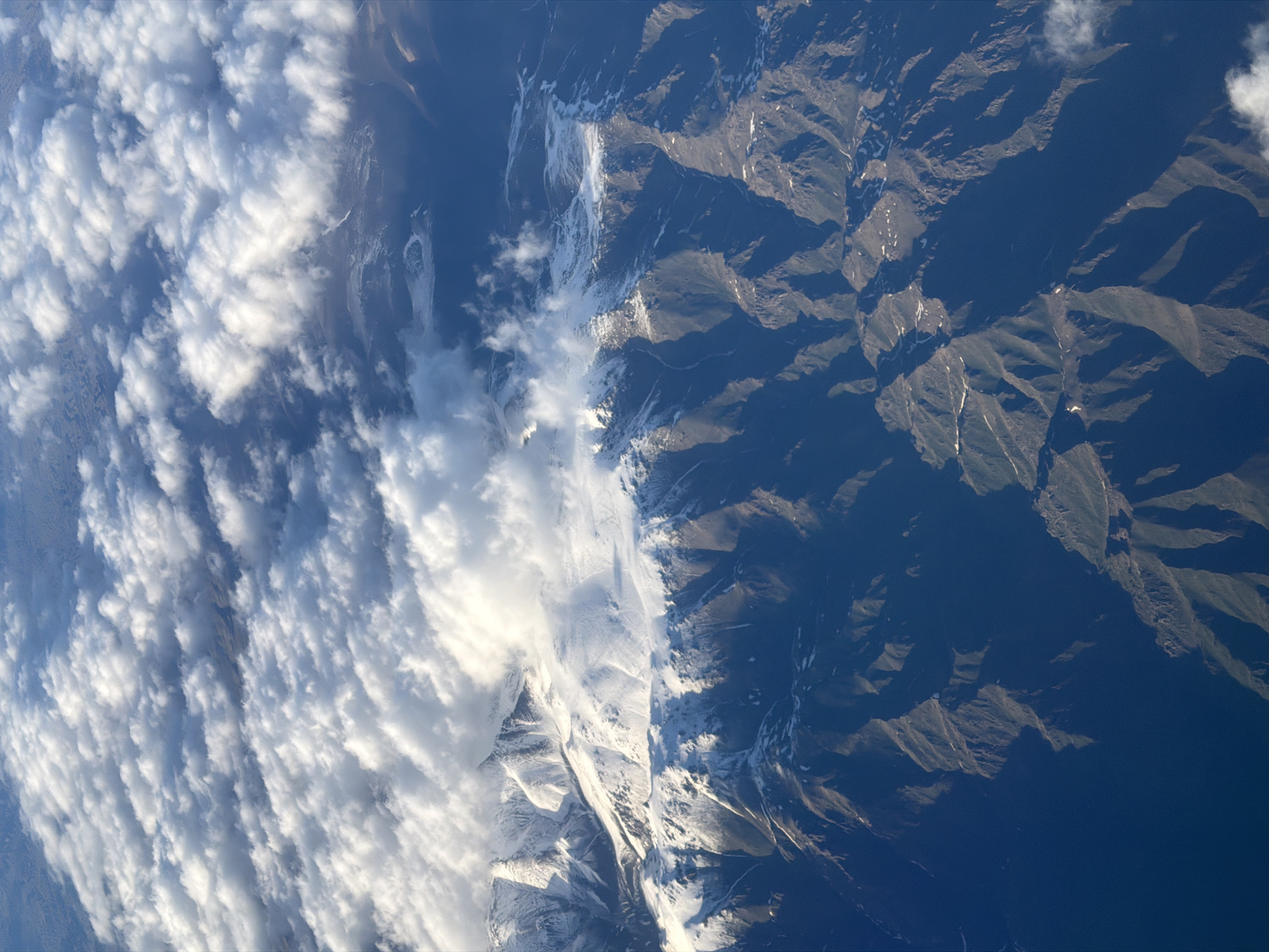 Aerial view captures snow-covered mountains near Pyatigorskoye, Kazakhstan