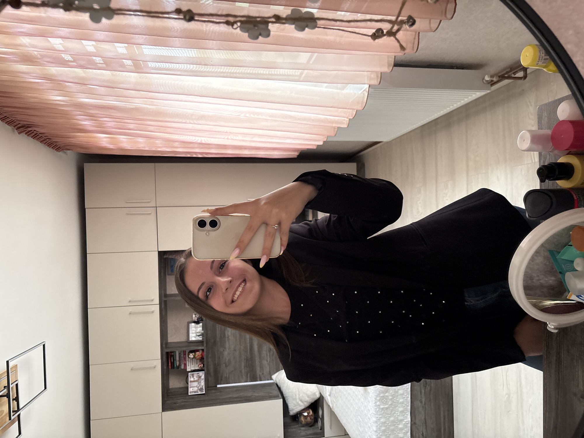 Young woman takes mirror selfies in Bulgarovo, Bulgaria