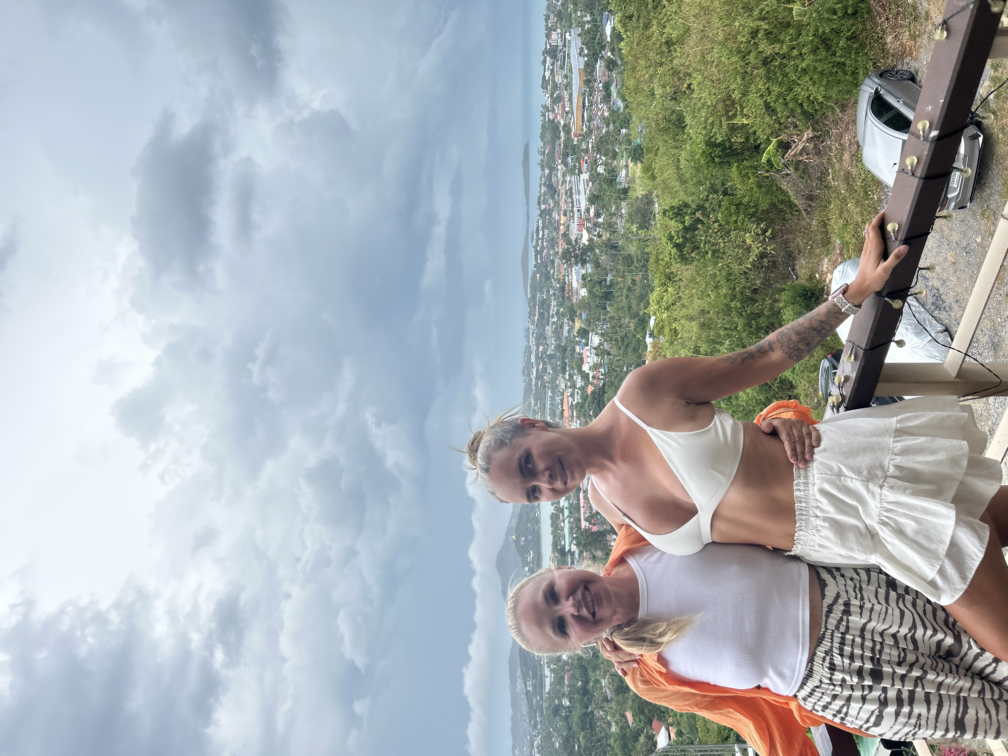 Balcony morning in Ko Samui, cloudy skies over town and coast