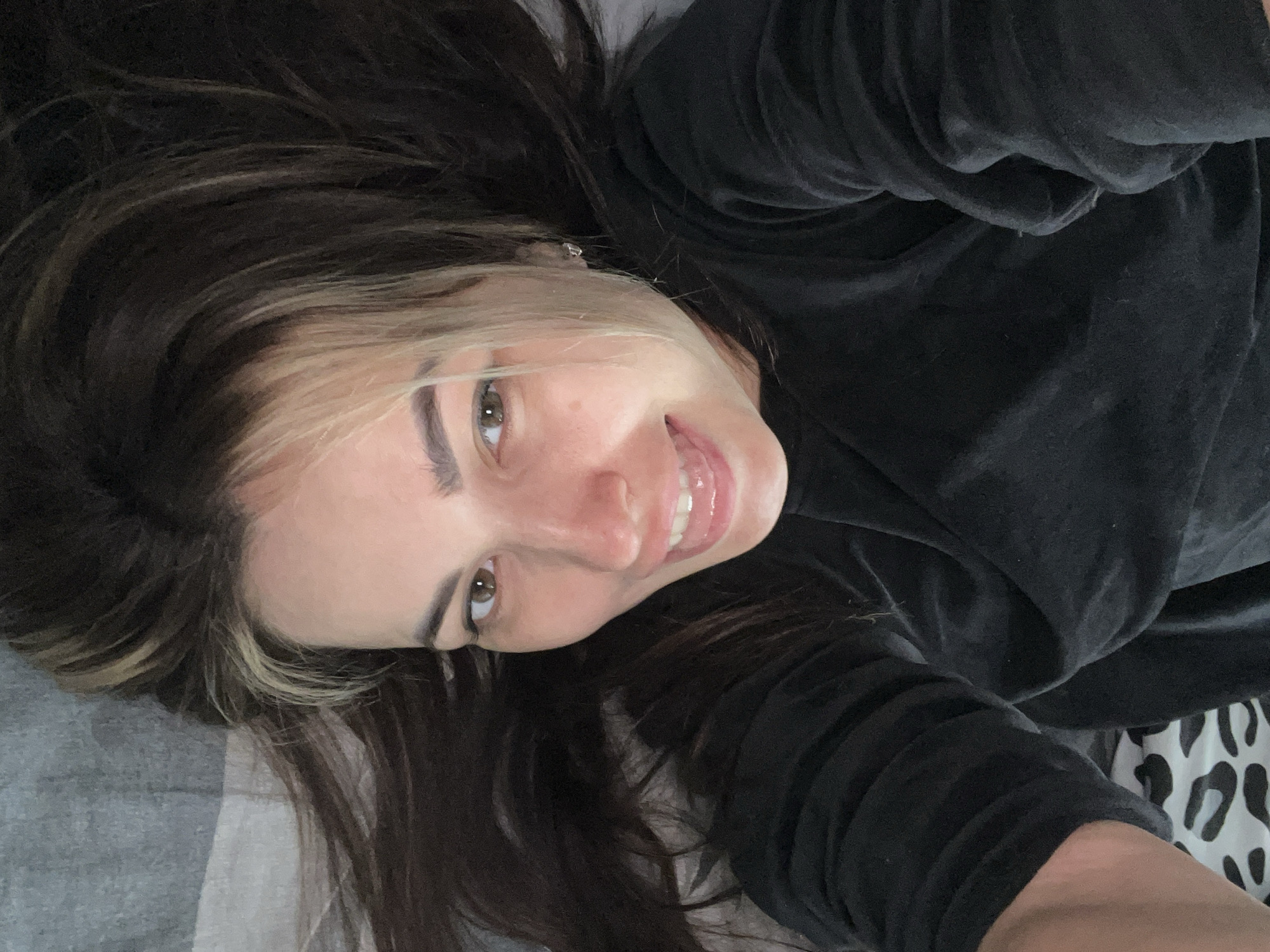 Woman captures series of selfies in bedroom setting
