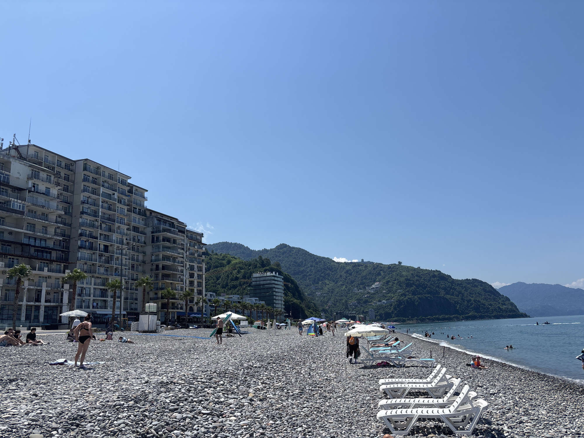 Batumi's pebble beach on a busy summer morning