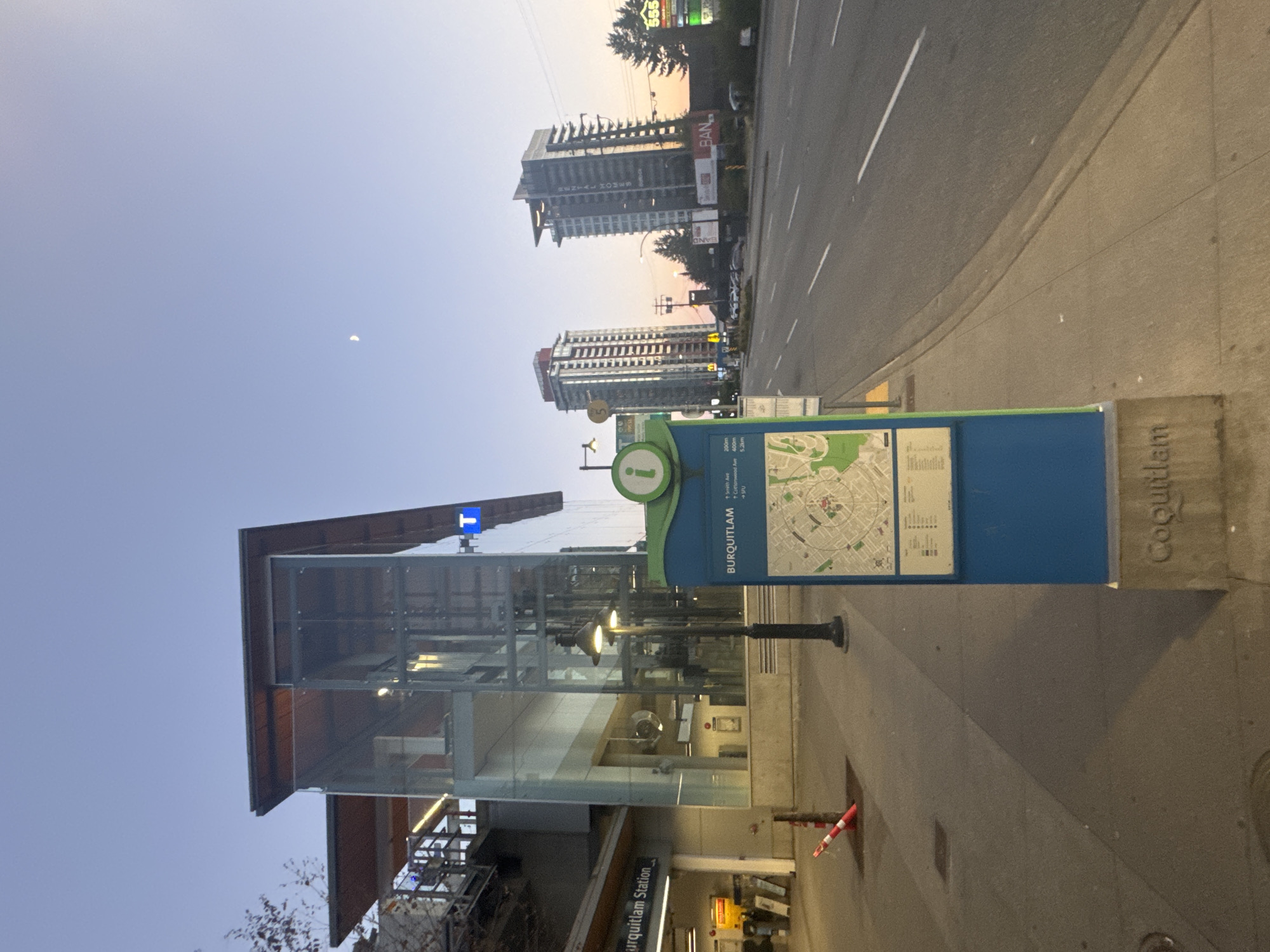 Burquitlam Station area at dusk, transit and towers.
