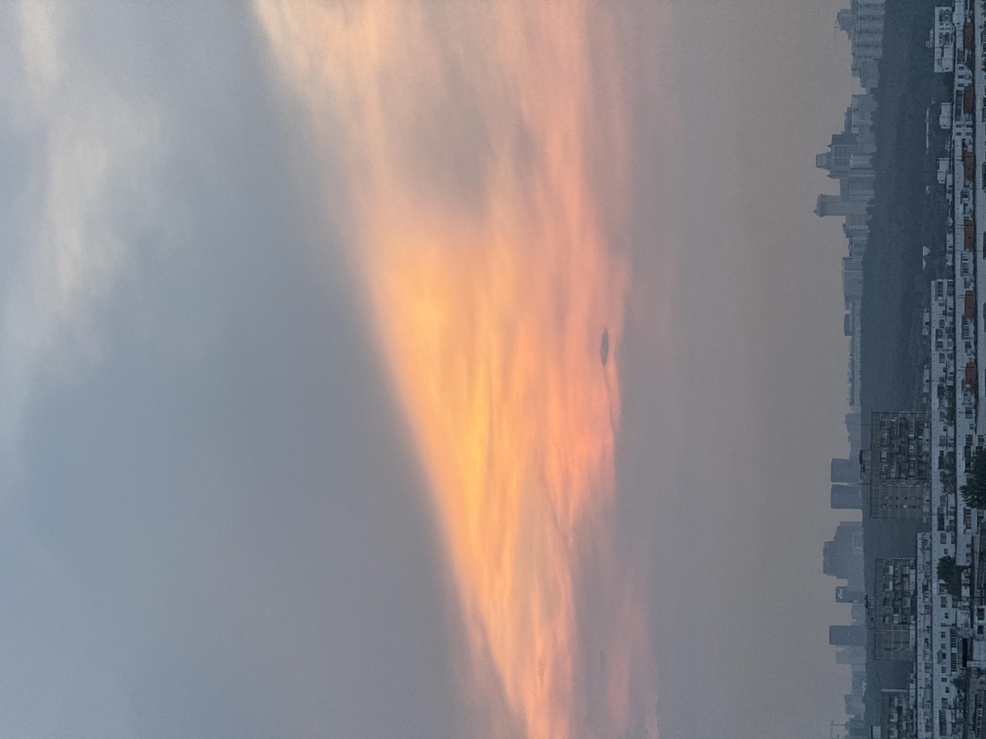 Vibrant sunset captured over Borduki cityscape at dusk