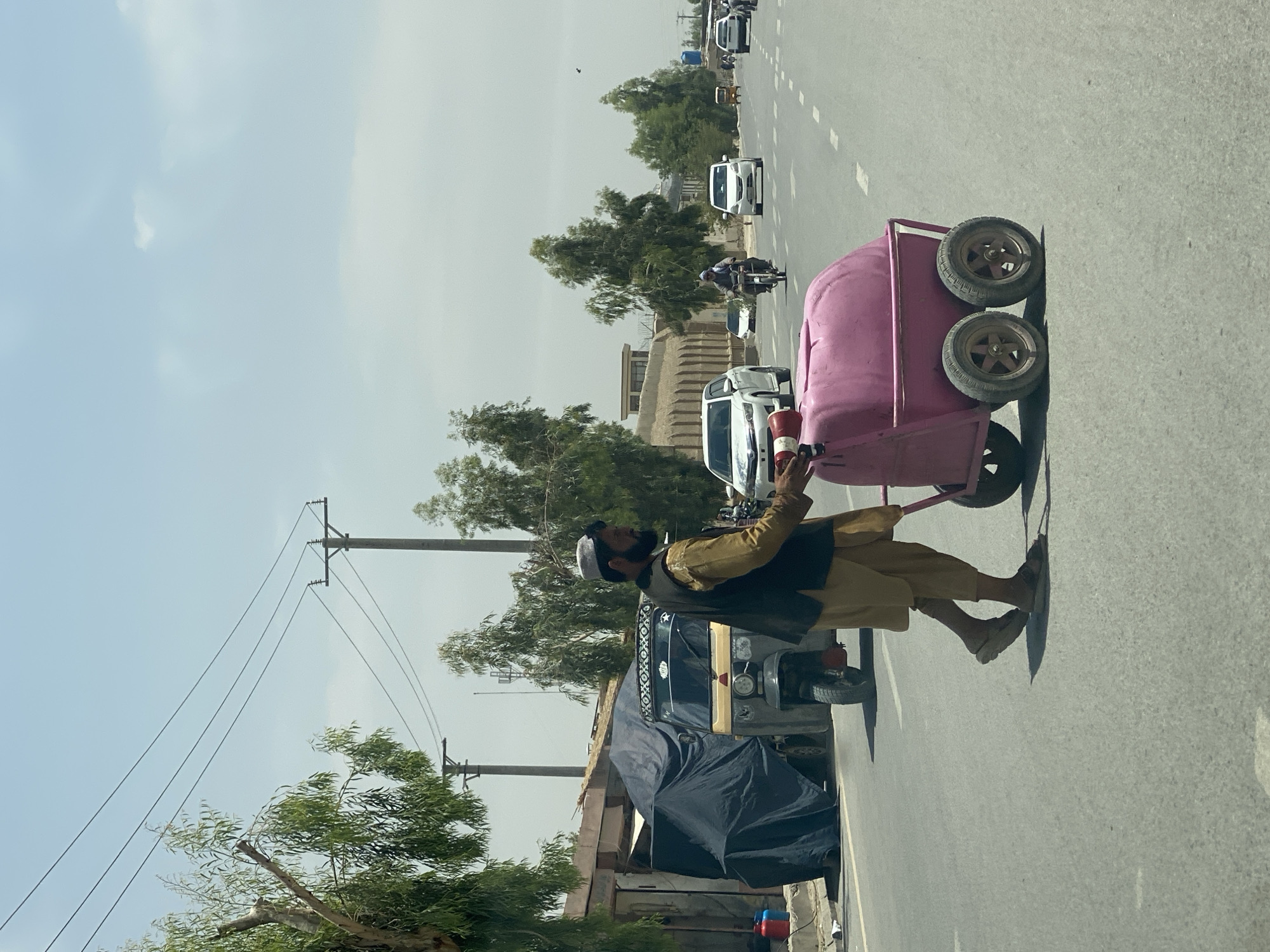 Pink barrel cart rolling through Kandahar streets