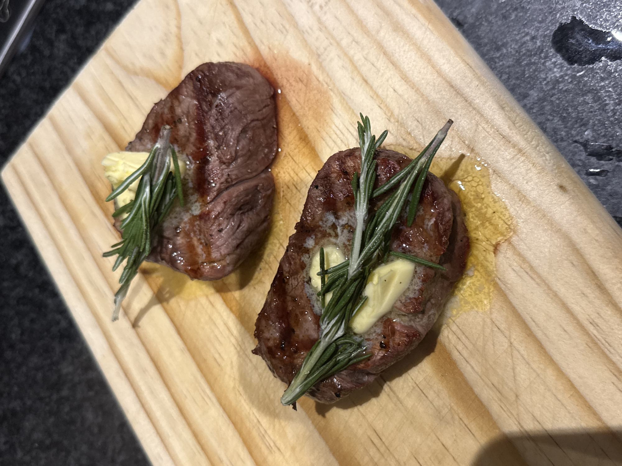 Cape Town resident grills steak dinner with corn, mushrooms