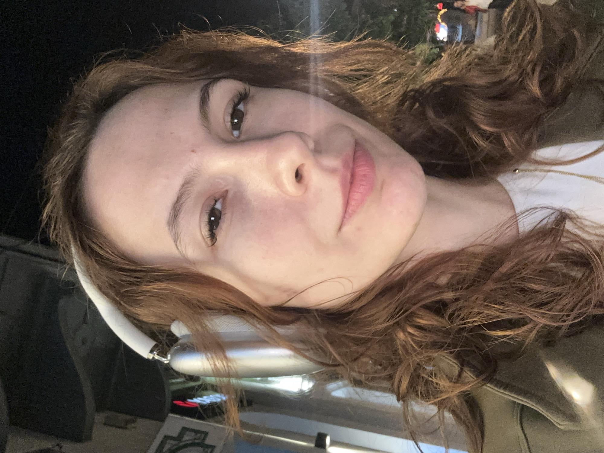 Woman takes selfie near Serbian National Theatre in Novi Sad