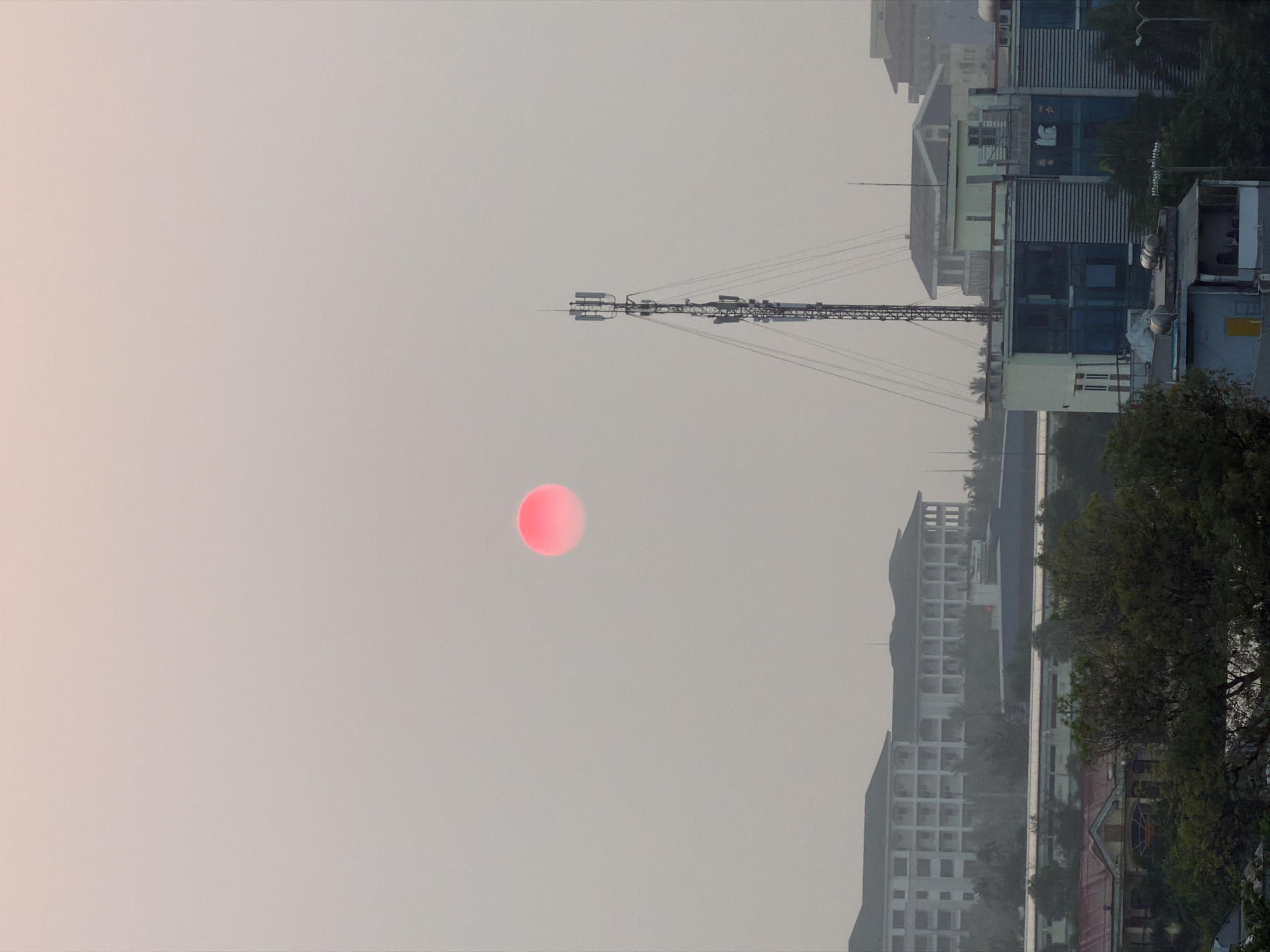 Sunset captured over Đà Nẵng cityscape from aerial view