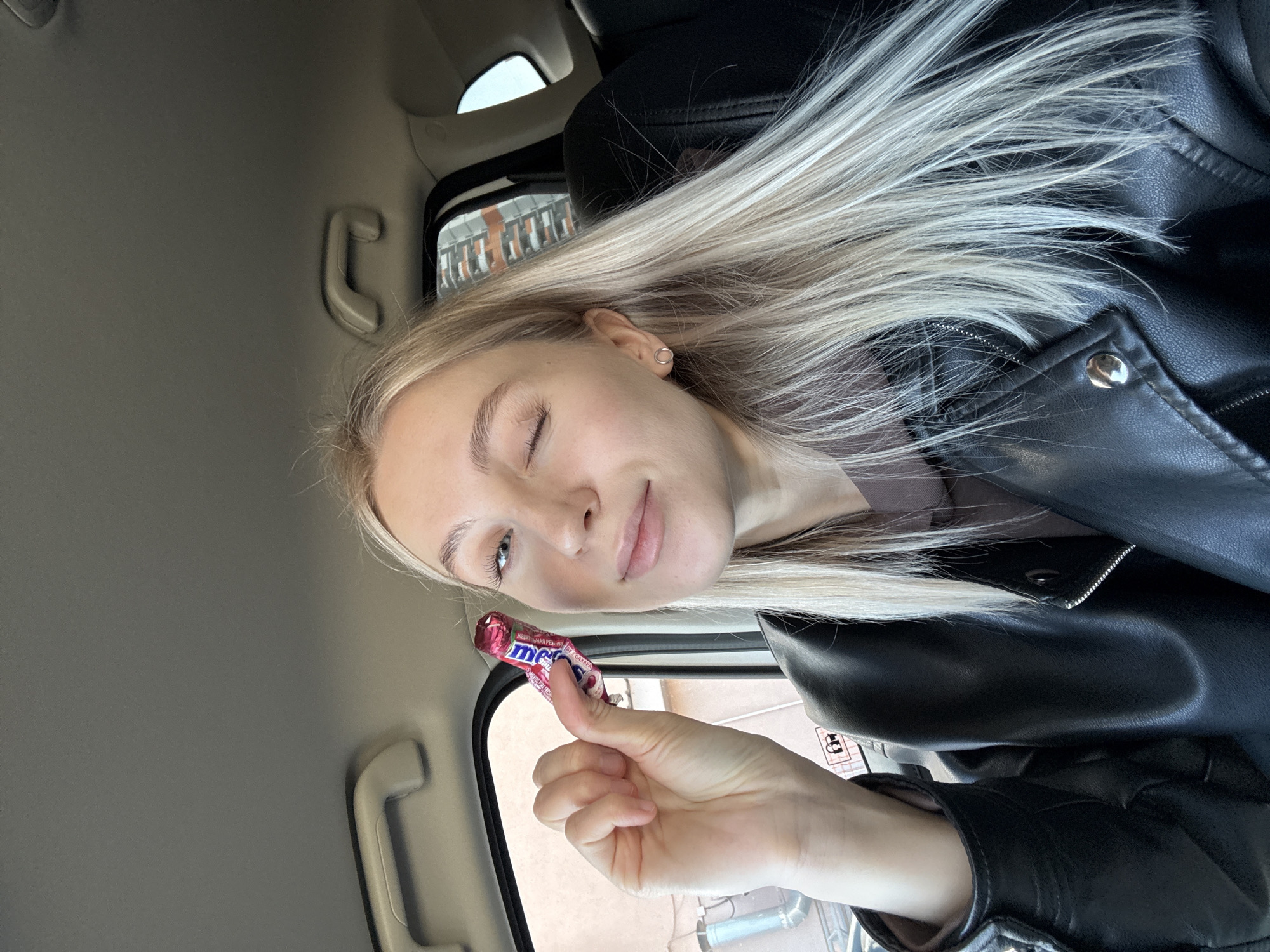 Woman takes selfies with candy in car in Izhevsk