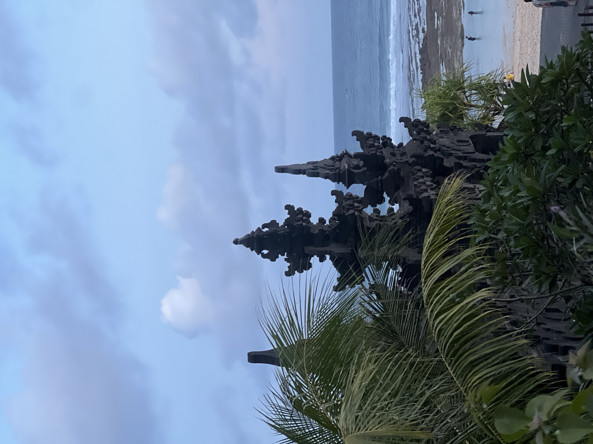 Coastal scenes and cultural statues documented in Kuta Selatan