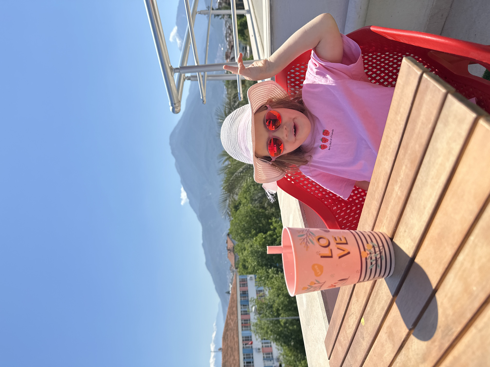 Woman with baby prepares coffee, travels elevator in Fethiye