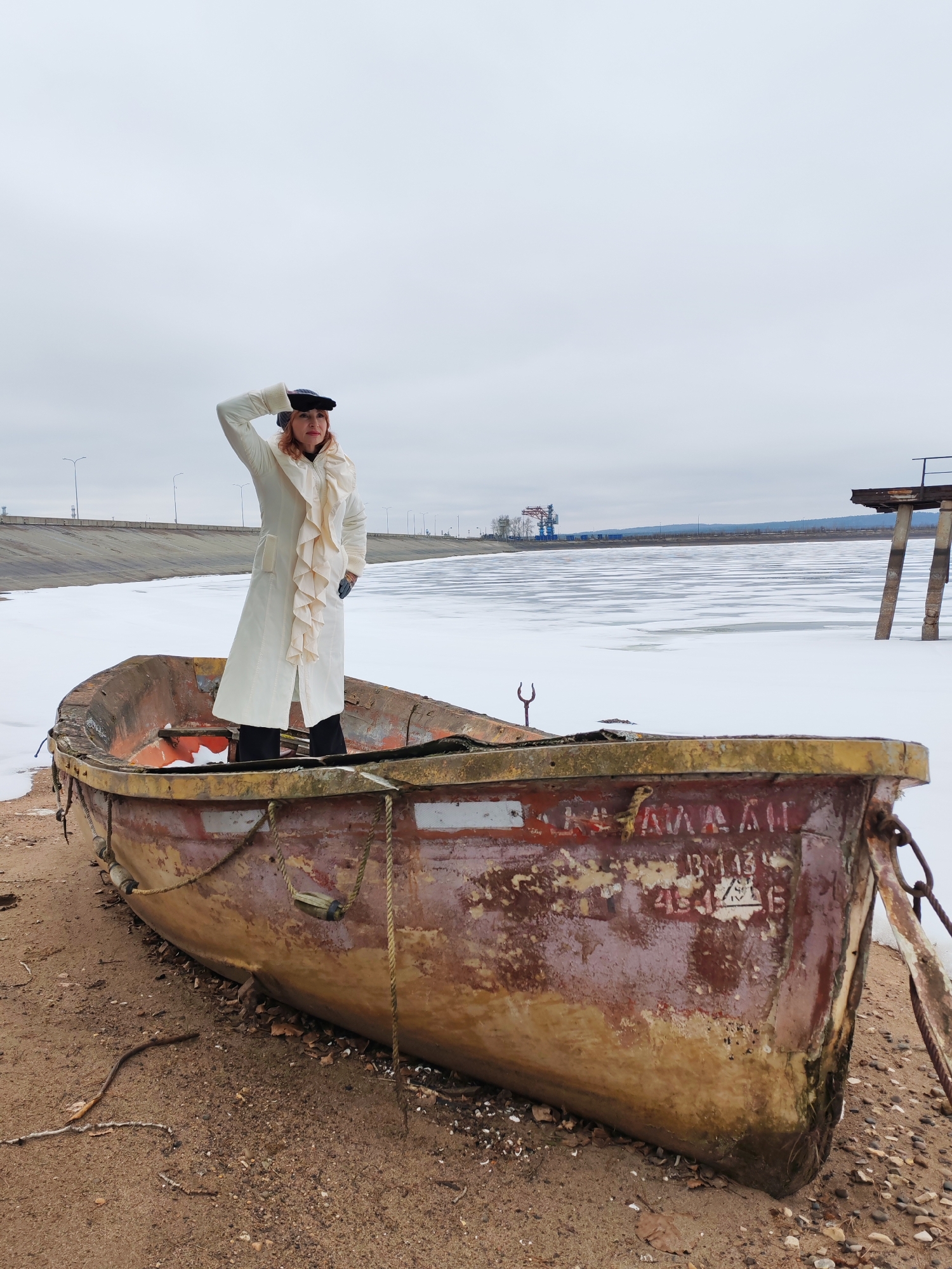 Woman photographed in winter scenes around Chaikovsky, Russia shoreline