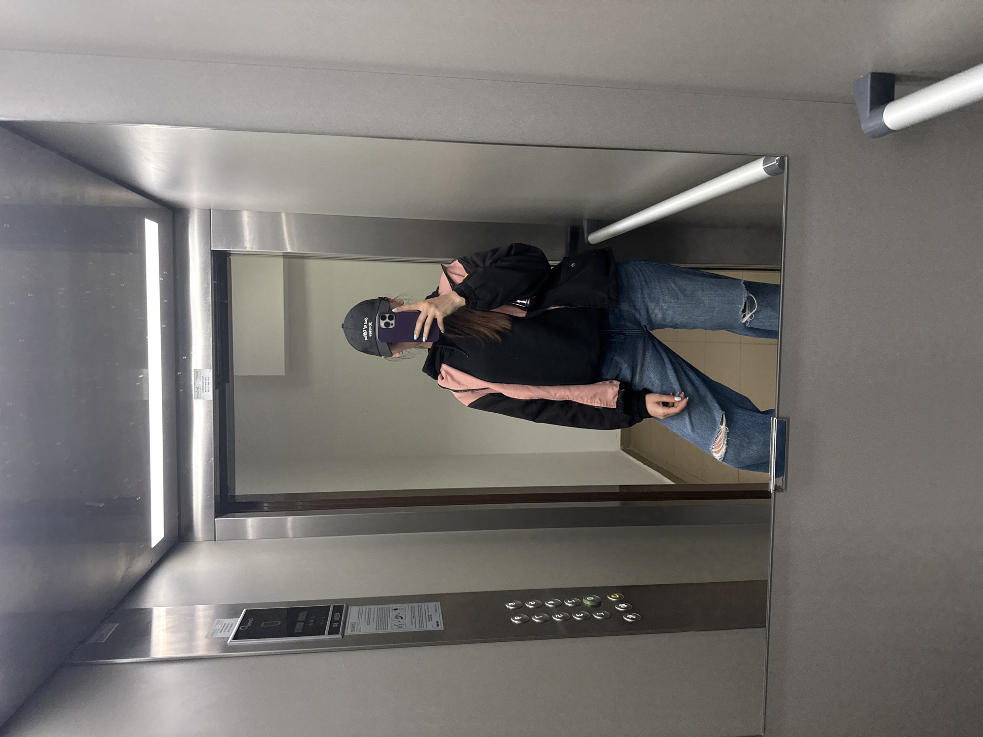 Person documented in elevator and building exterior in Plovdiv