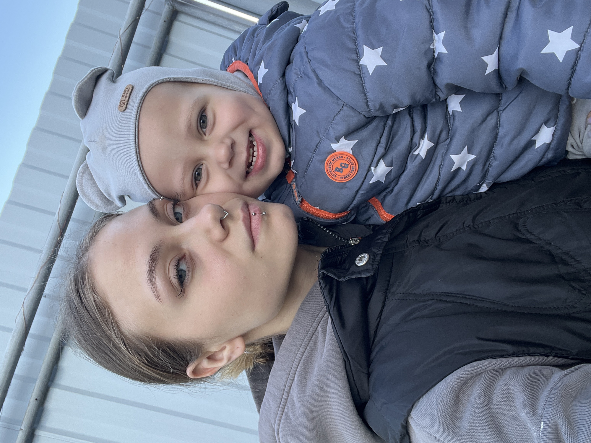 Woman and child take selfie in Russian town