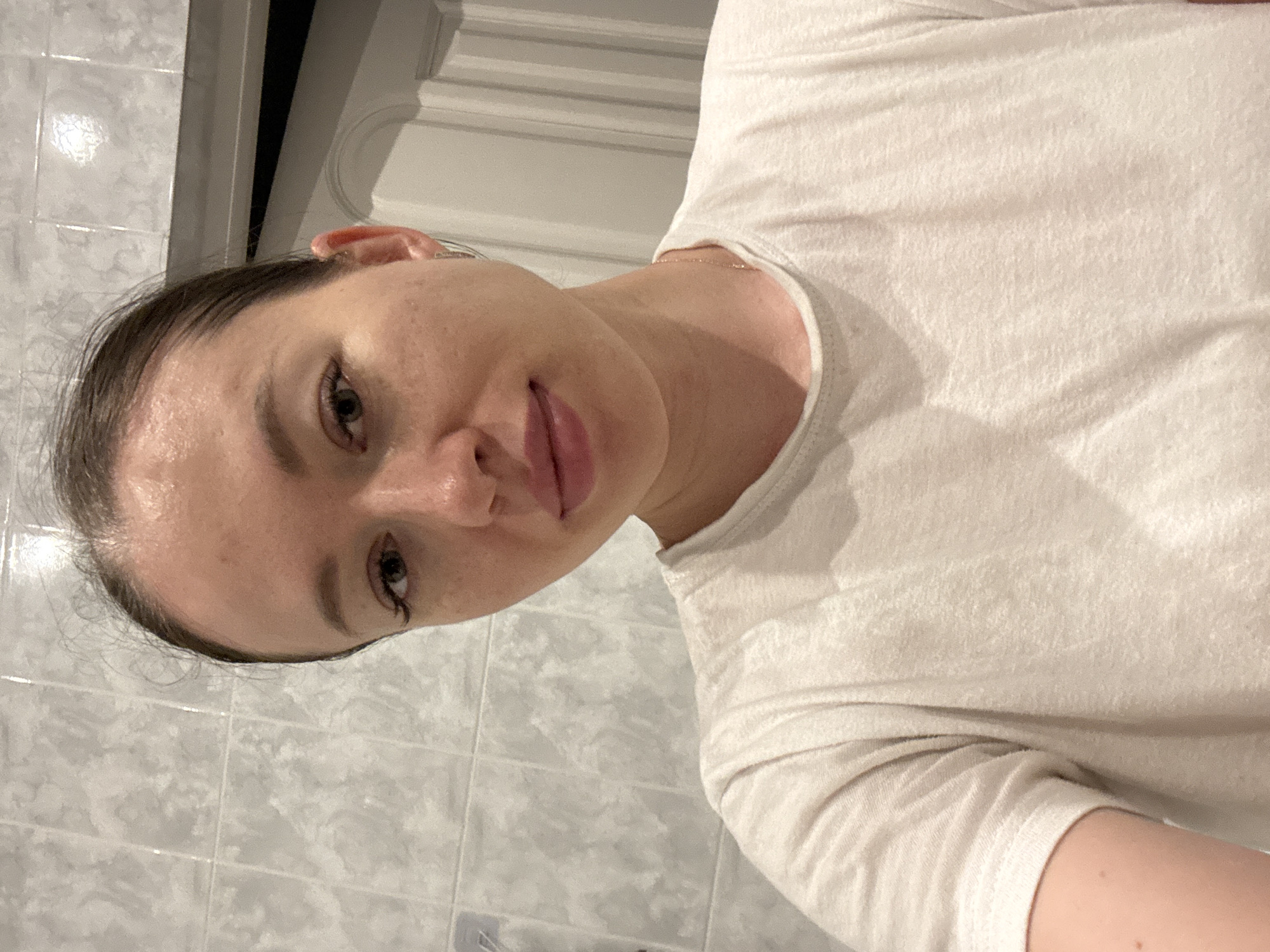 Person photographed in bathroom setting in Ферма, Russia