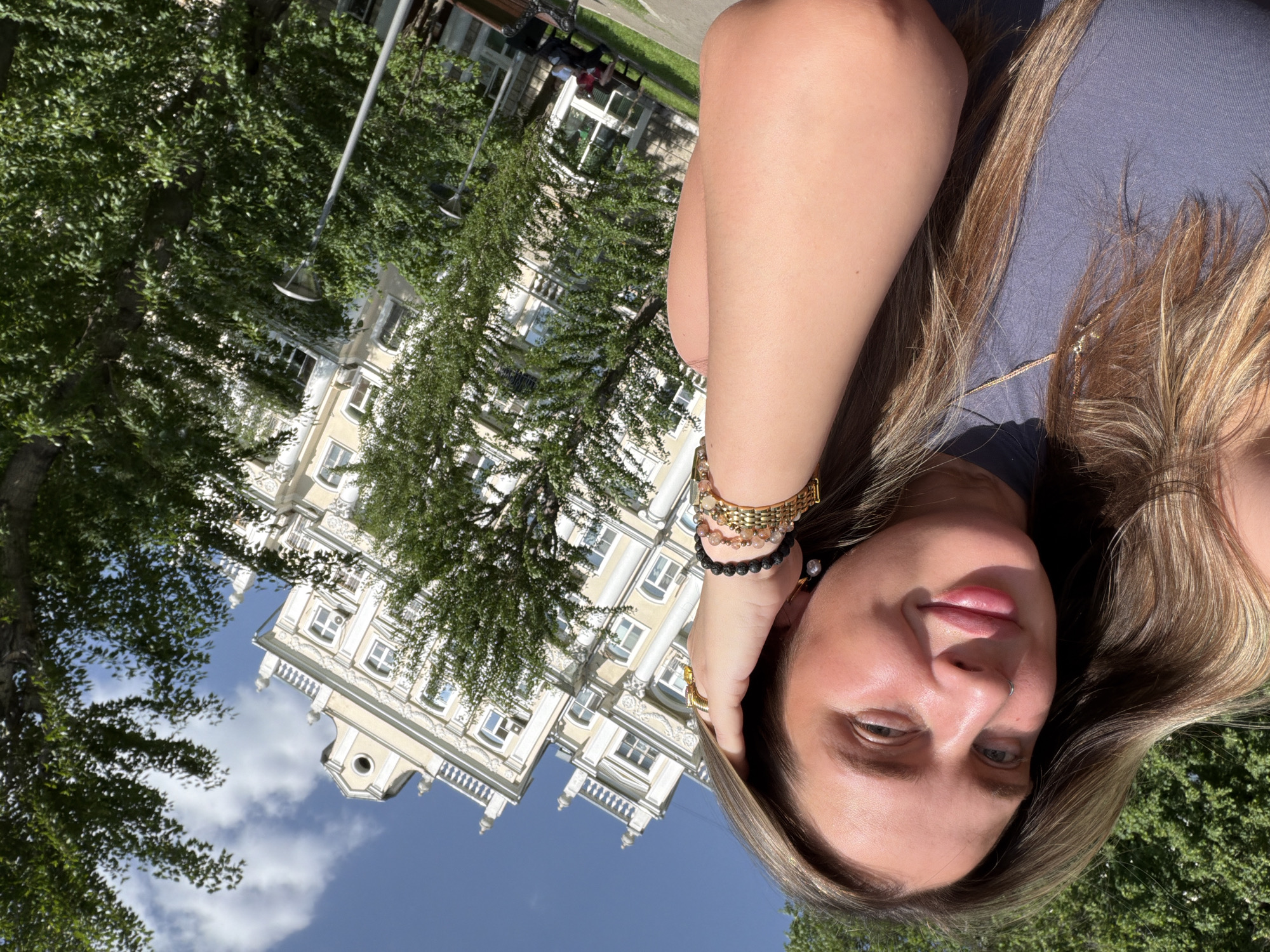 Person photographed amid Shcherbinka cityscape with distinctive tower