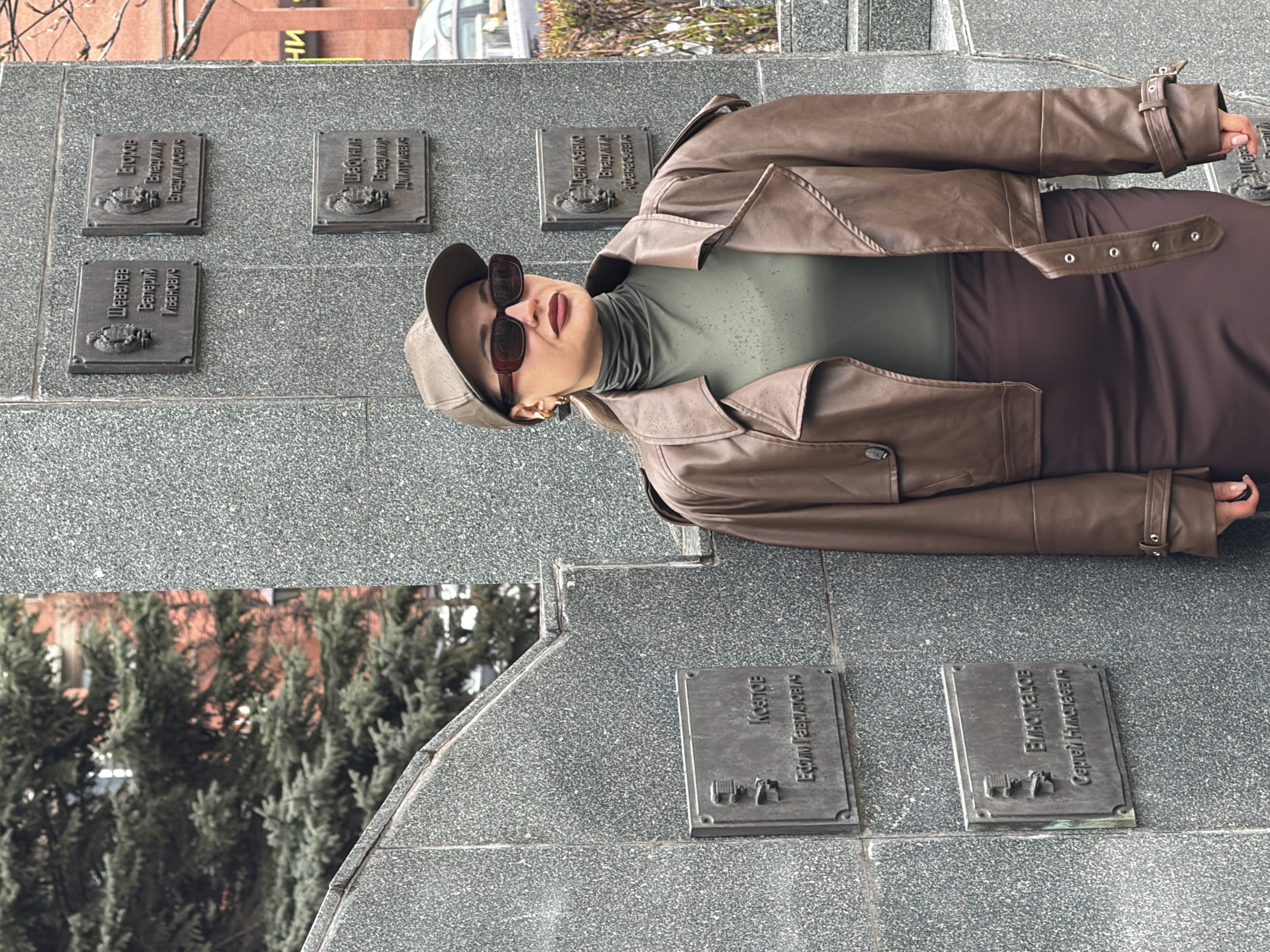 Woman visits memorial monument in rainy Krasnoyarsk morning