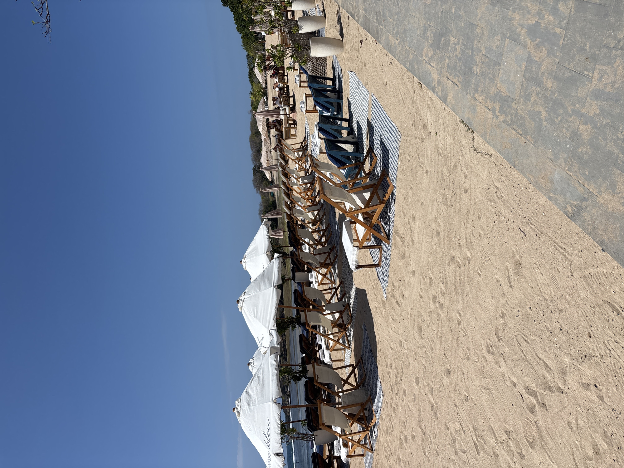 Kuta Selatan beachfront promenade, active and laid-back on a sunny morning